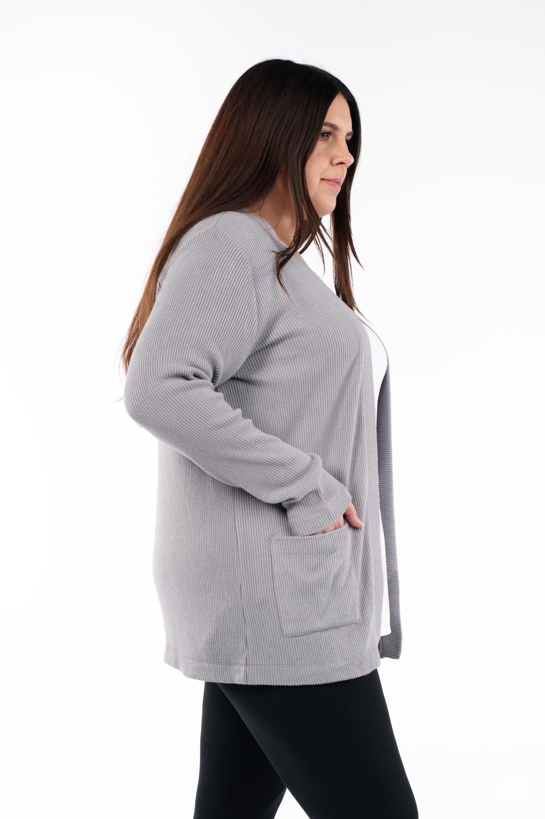 Side view of woman wearing SweetLegs Canada Ribbed Comfort Cardigan in dusty grey with front pocket and relaxed fit