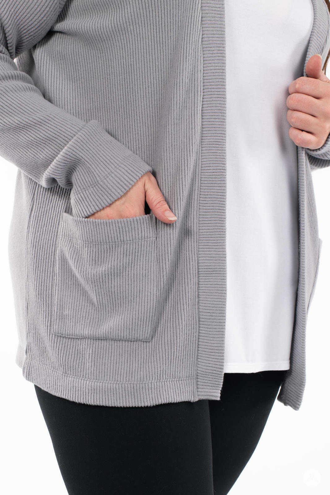 Close-up of hand in pocket showing SweetLegs Canada Ribbed Comfort Cardigan in soft grey ribbed fabric