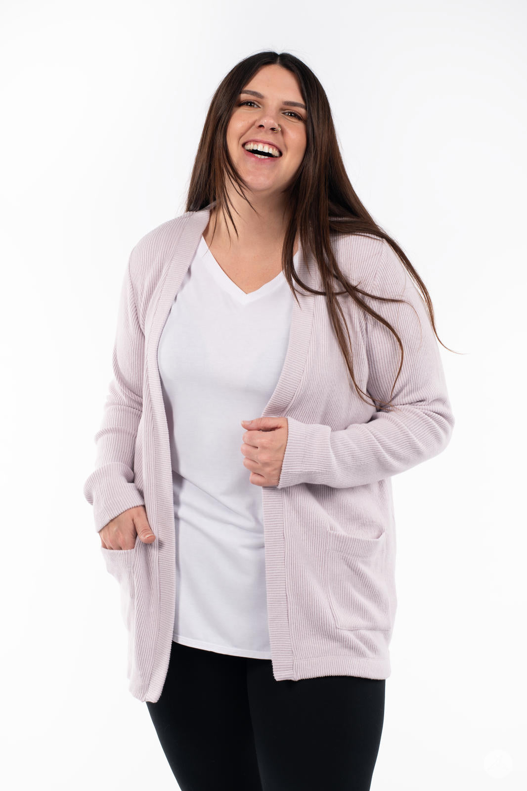 Smiling woman wearing SweetLegs Canada Ribbed Comfort Cardigan in soft dusty pink with an open front and pockets
