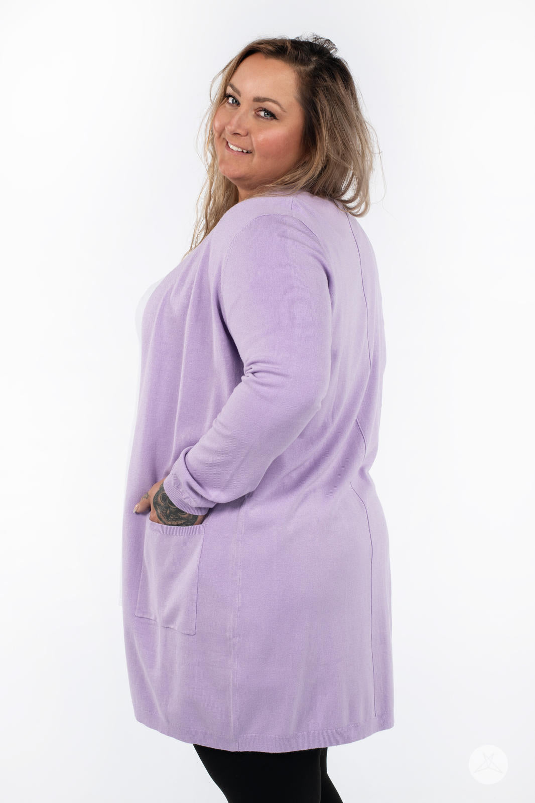 Plus-size model wearing SweetLegs Canada Spring Cardigan in lavender with patch pockets and long sleeves side view