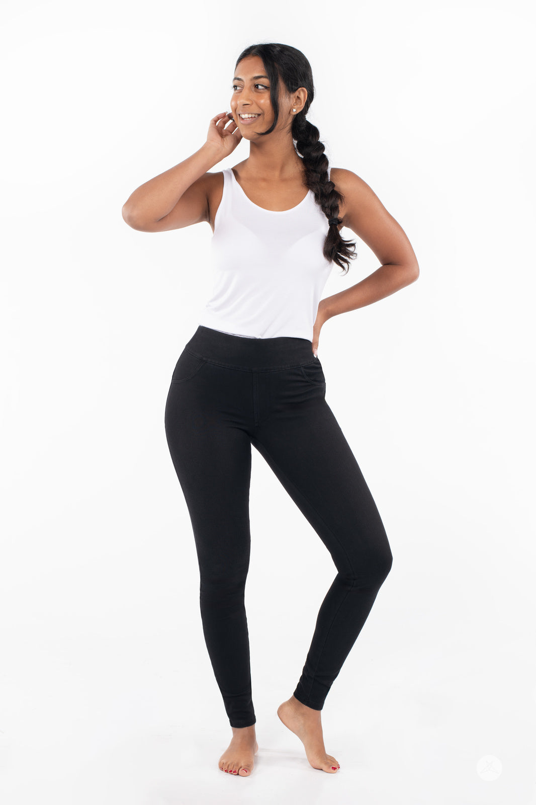 Model in black SweetLegs Denim High-Waisted Pocket Leggings standing barefoot with soft cotton-blend stretch fabric