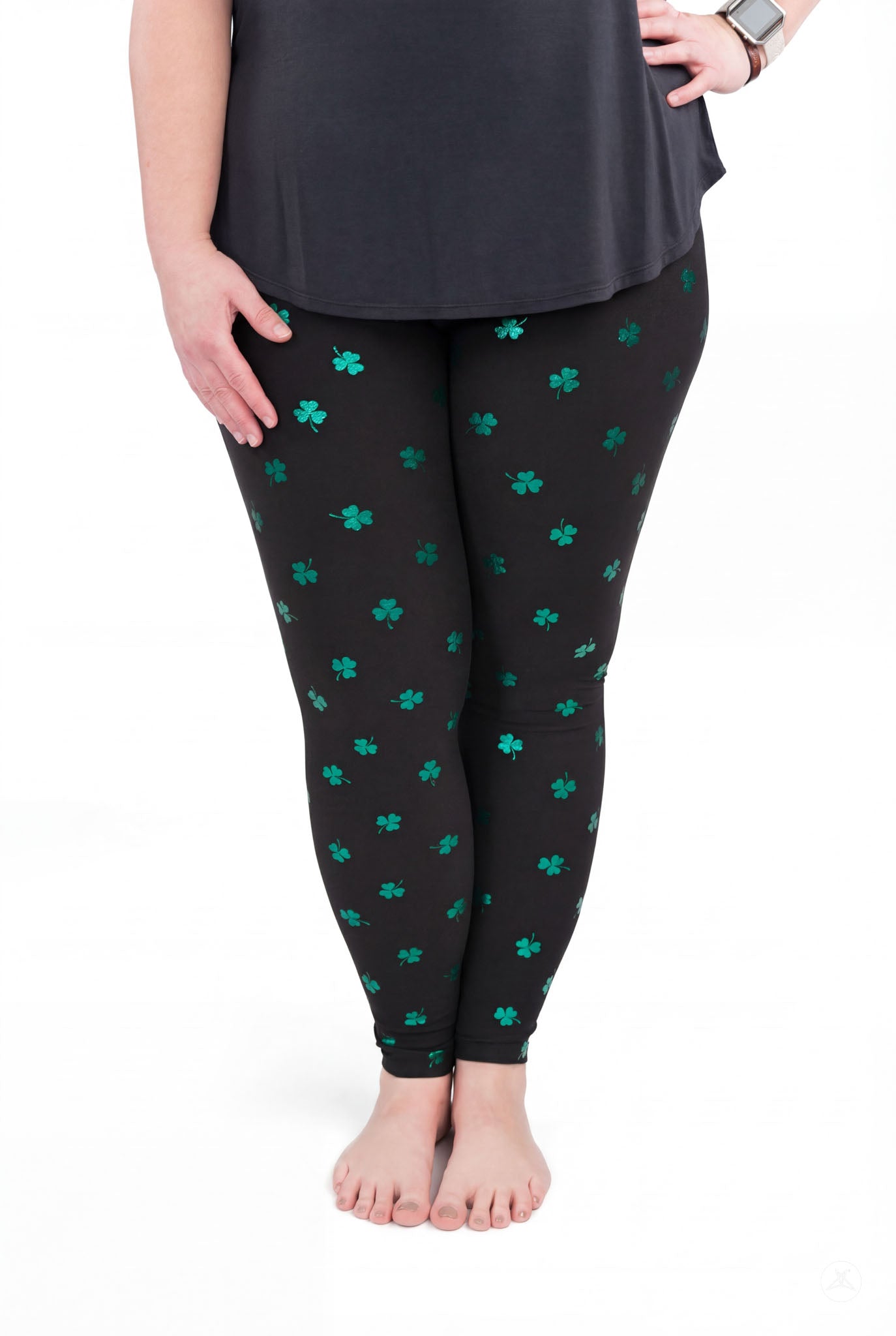Lucky Glow leggings by SweetLegs feature a scattered shamrock print with bright emerald foil on a black background