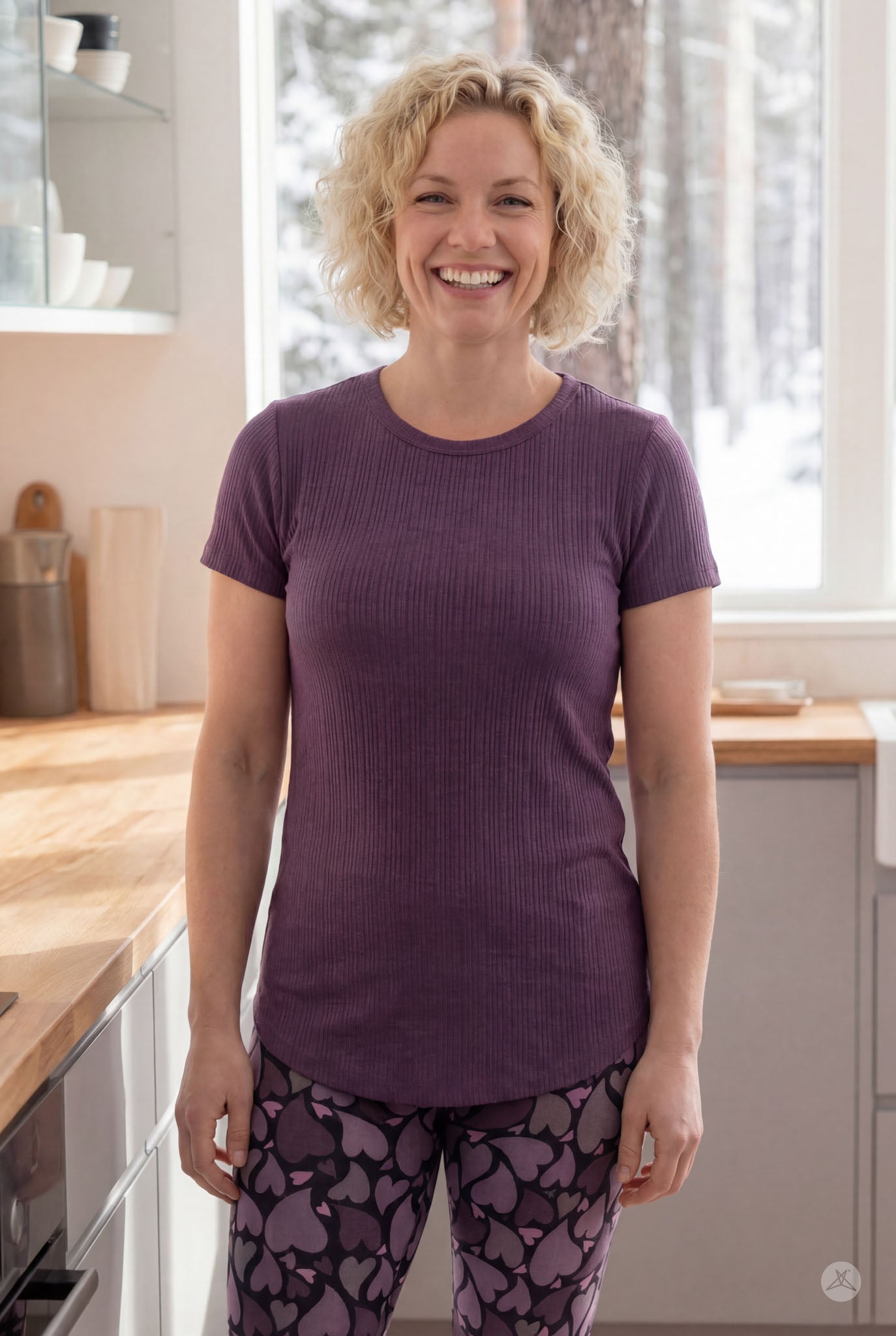 Woman smiling wearing purple The Soft Ribbed Tee by SweetLegs Canada with rib-knit fabric and crew neckline front view