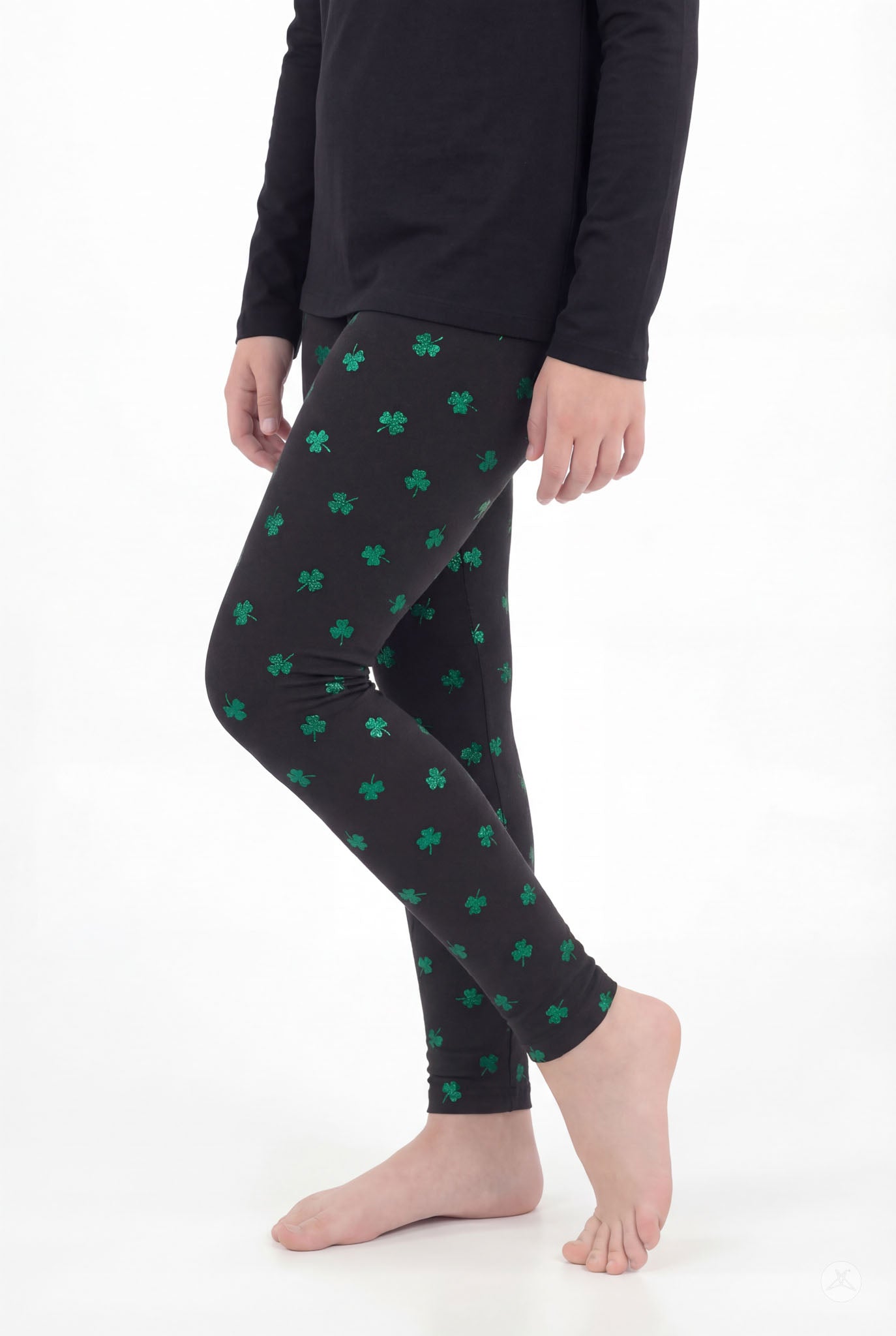 Lucky Glow Kids leggings by SweetLegs featuring bright emerald shamrocks on a soft black stretchy fabric for kids.