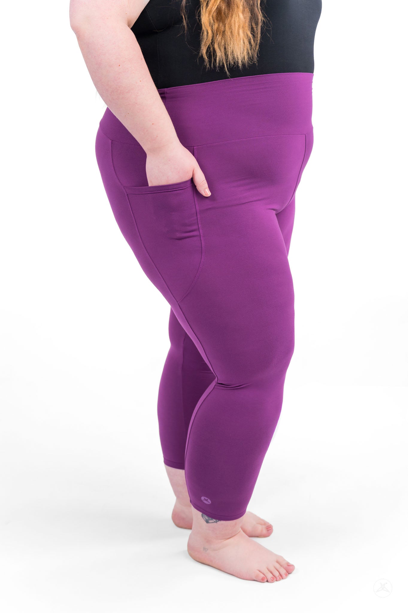 Plus size model wearing sweetlegs Deep Plum High-Waisted Pocket Crops with side pocket detail on white background