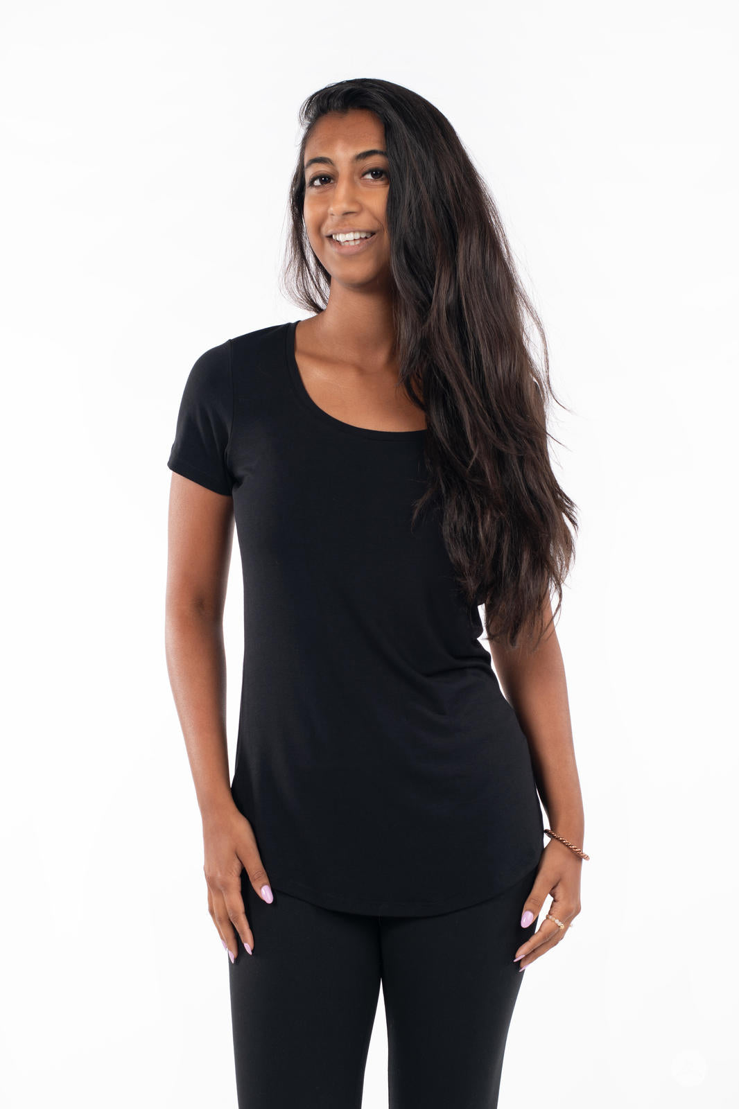 Woman wearing SweetLegs Canada Scoop Neck Tee in black with short sleeves and curved hem front view