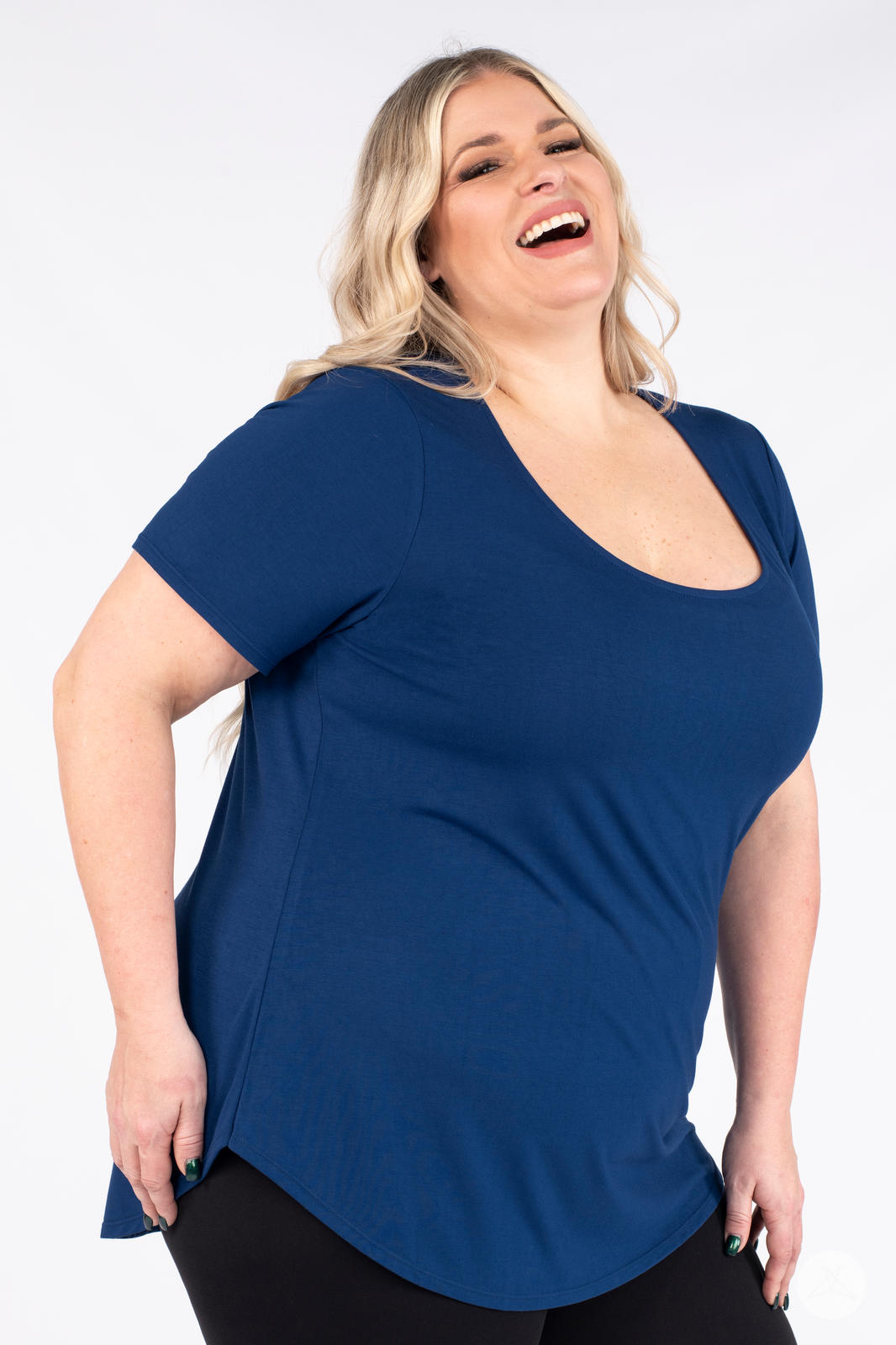 Happy plus size woman wearing a navy Classic Tee by SweetLegs Canada with scoop neckline and relaxed fit front view