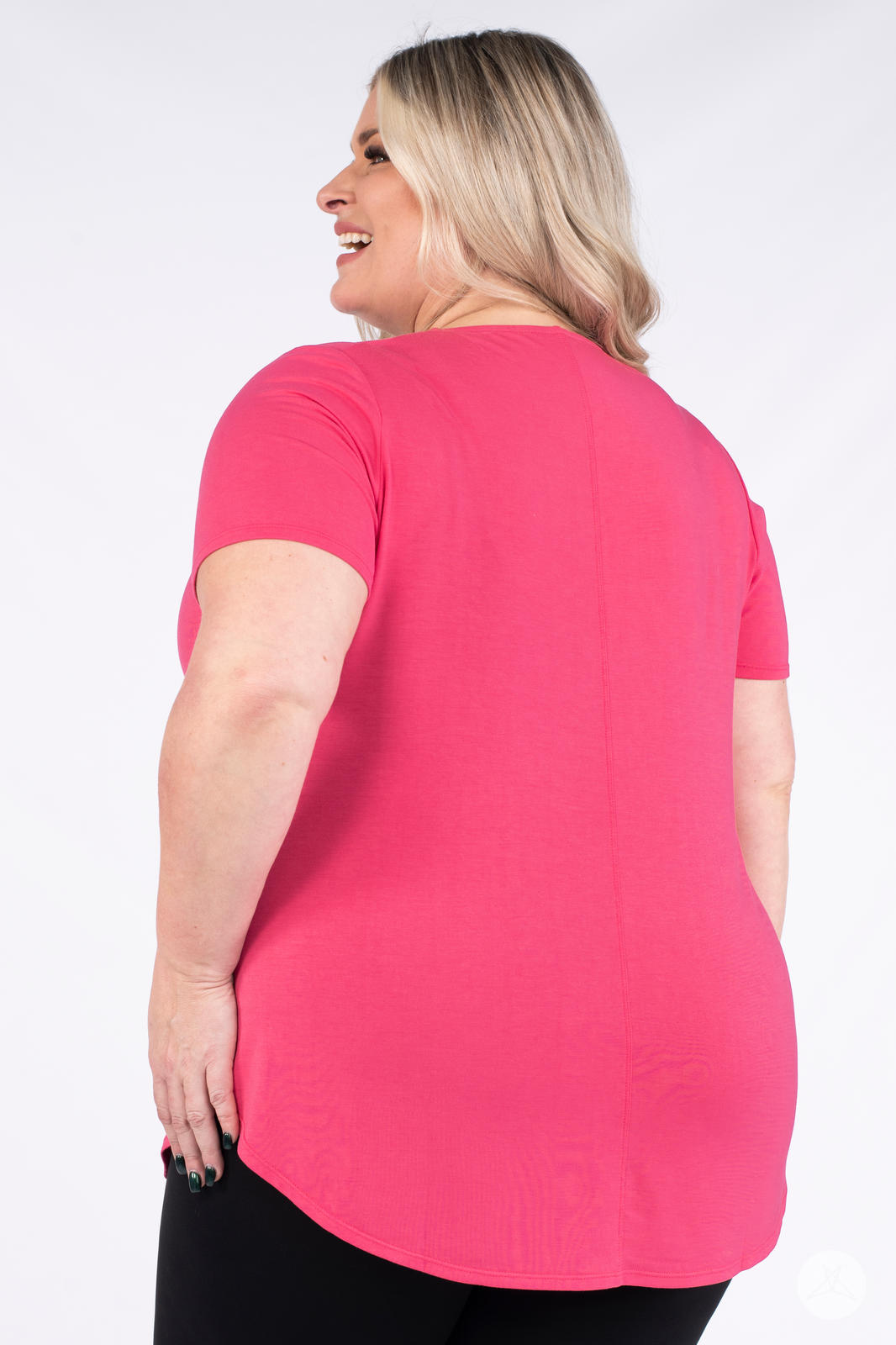 Plus size woman wearing hot pink Classic Tee by SweetLegs Canada showing back with short sleeves and curved hem