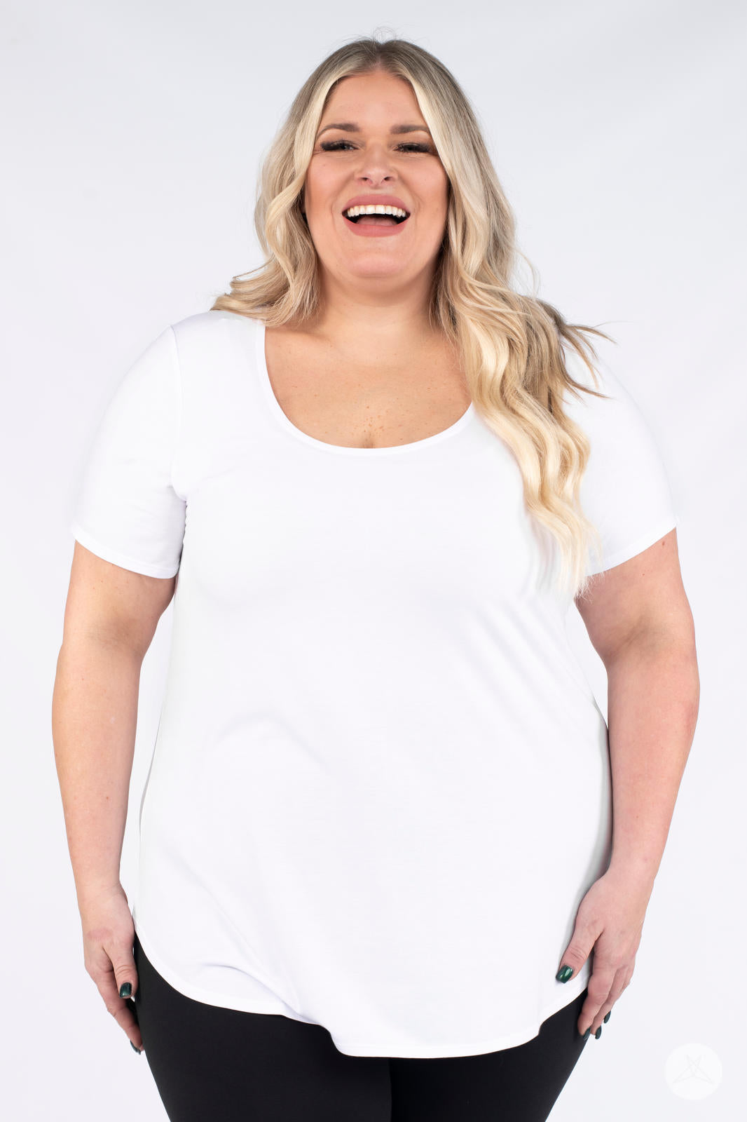 Plus size model smiling facing front wearing white Classic Tee by SweetLegs Canada with scoop neckline and short sleeves