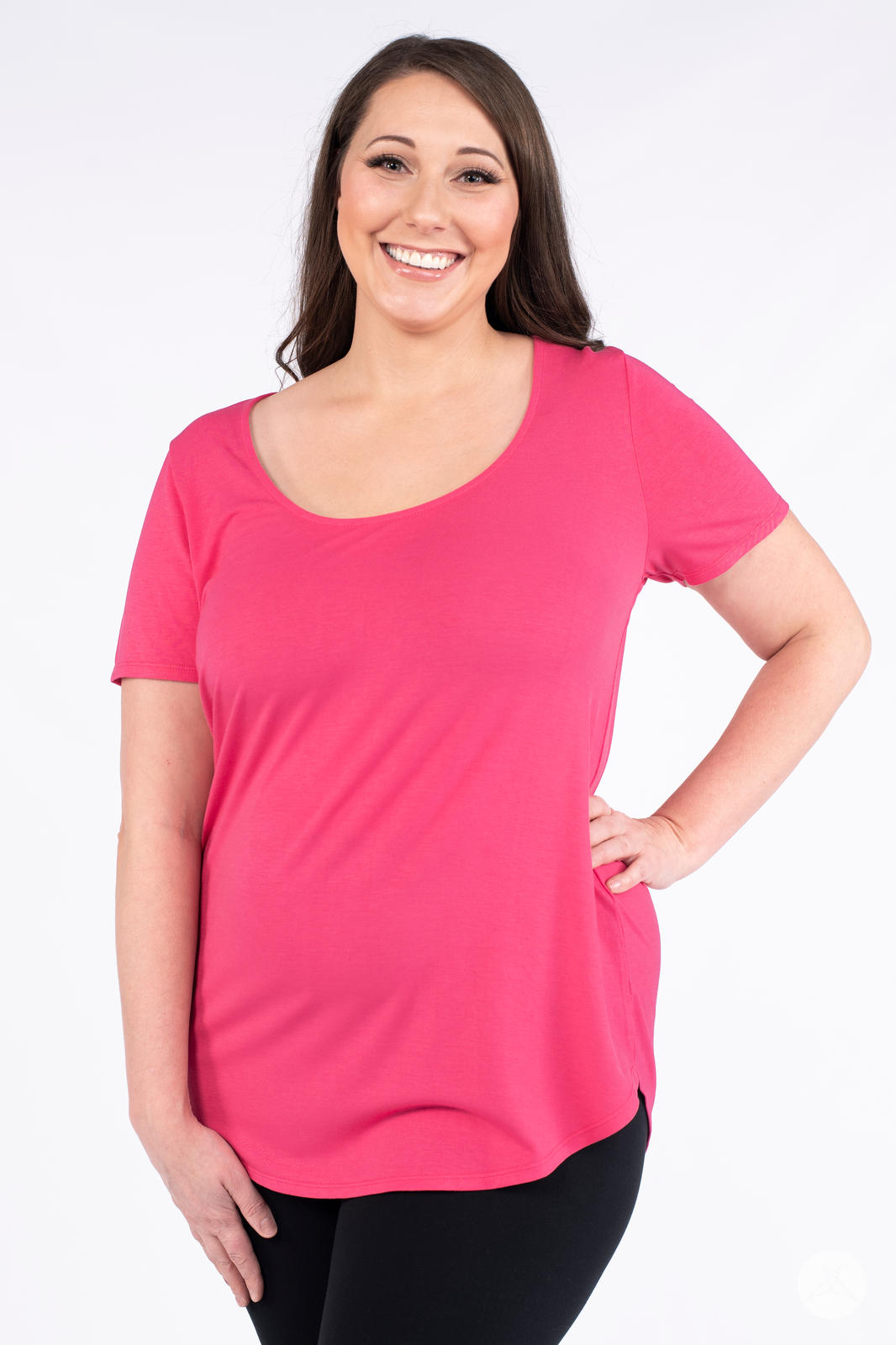 Smiling woman wearing hot pink Classic Tee by SweetLegs Canada with scoop neckline and relaxed fit front view