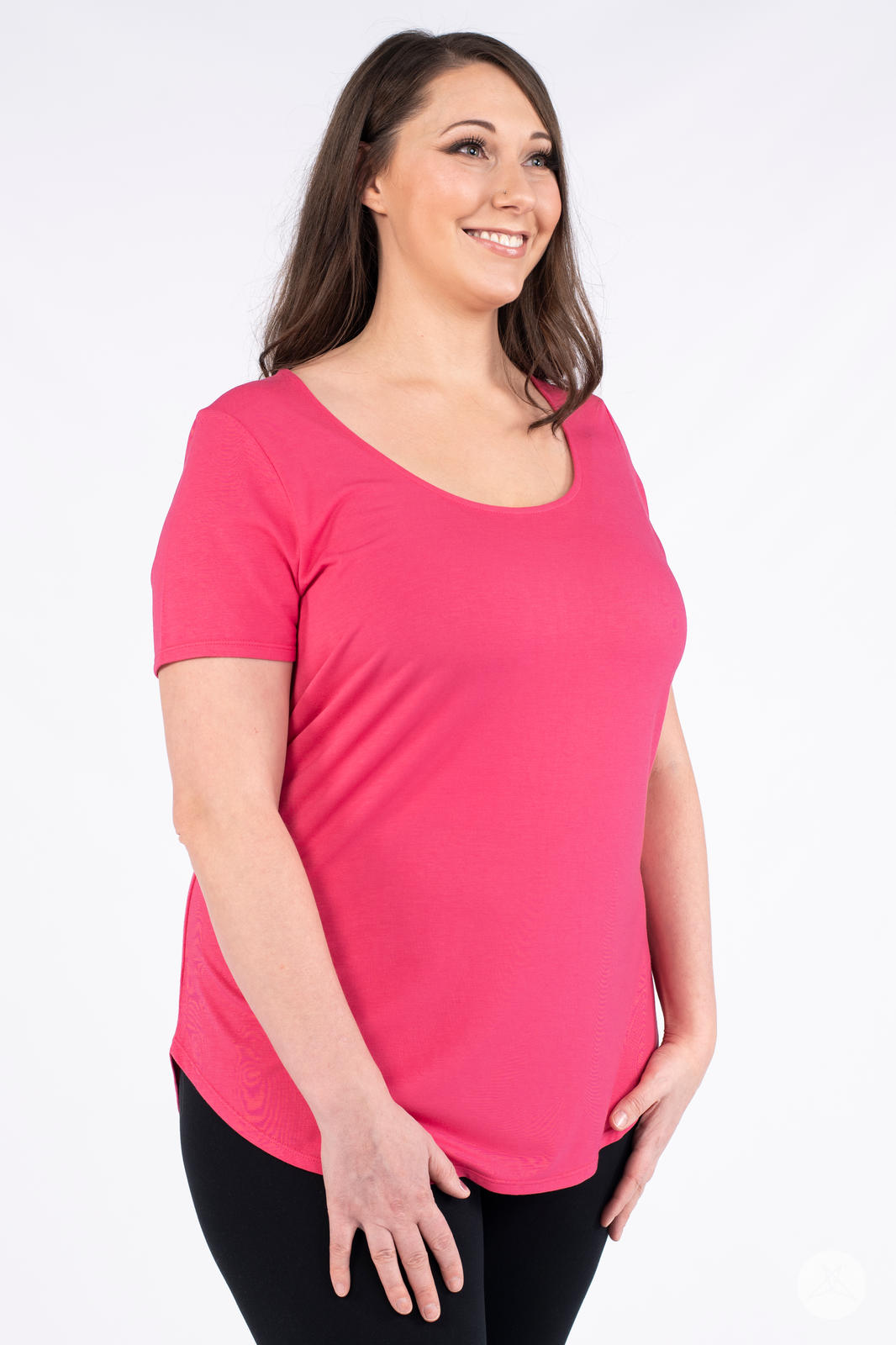Woman wearing bright pink Classic Tee by SweetLegs Canada with scoop neckline and relaxed fit angled view