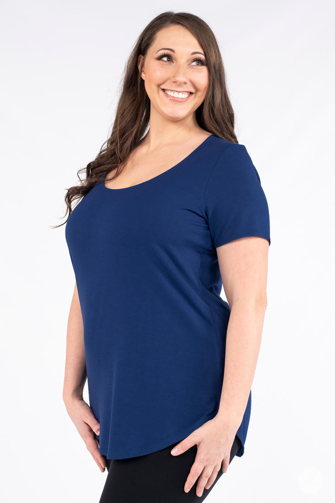 Plus size woman wearing navy Classic Tee by SweetLegs Canada with scoop neck and relaxed fit side view