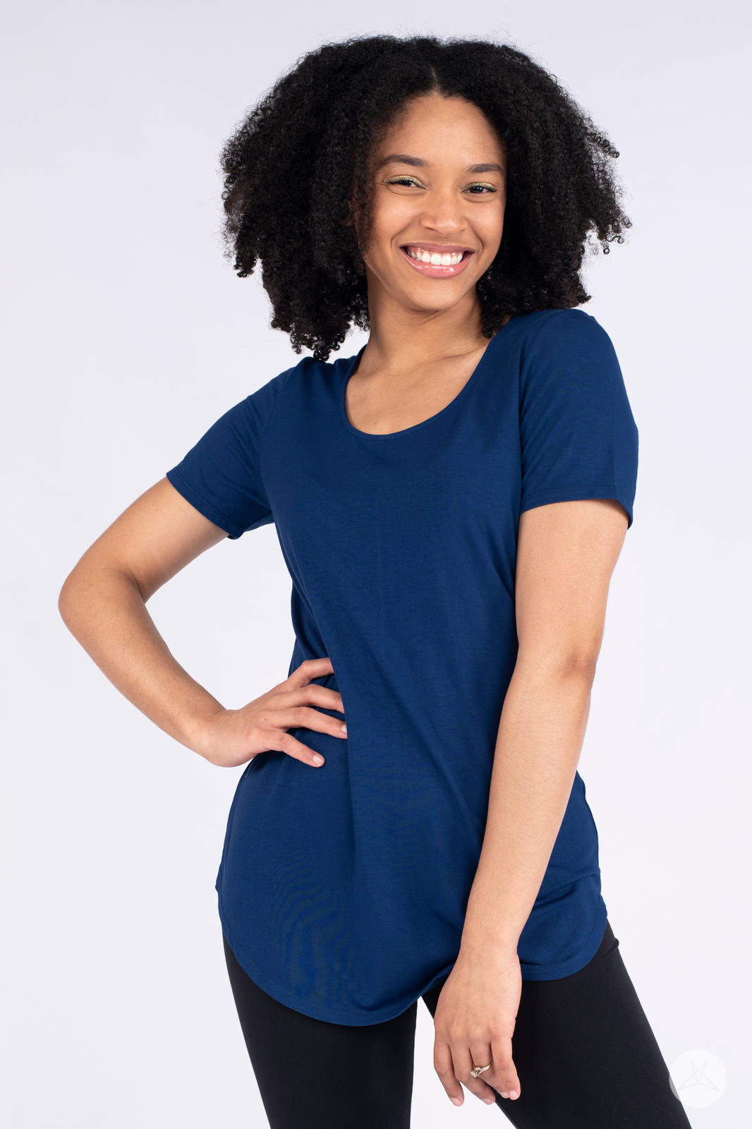 Smiling woman wearing navy Classic Tee by SweetLegs Canada with scoop neckline and relaxed fit front view