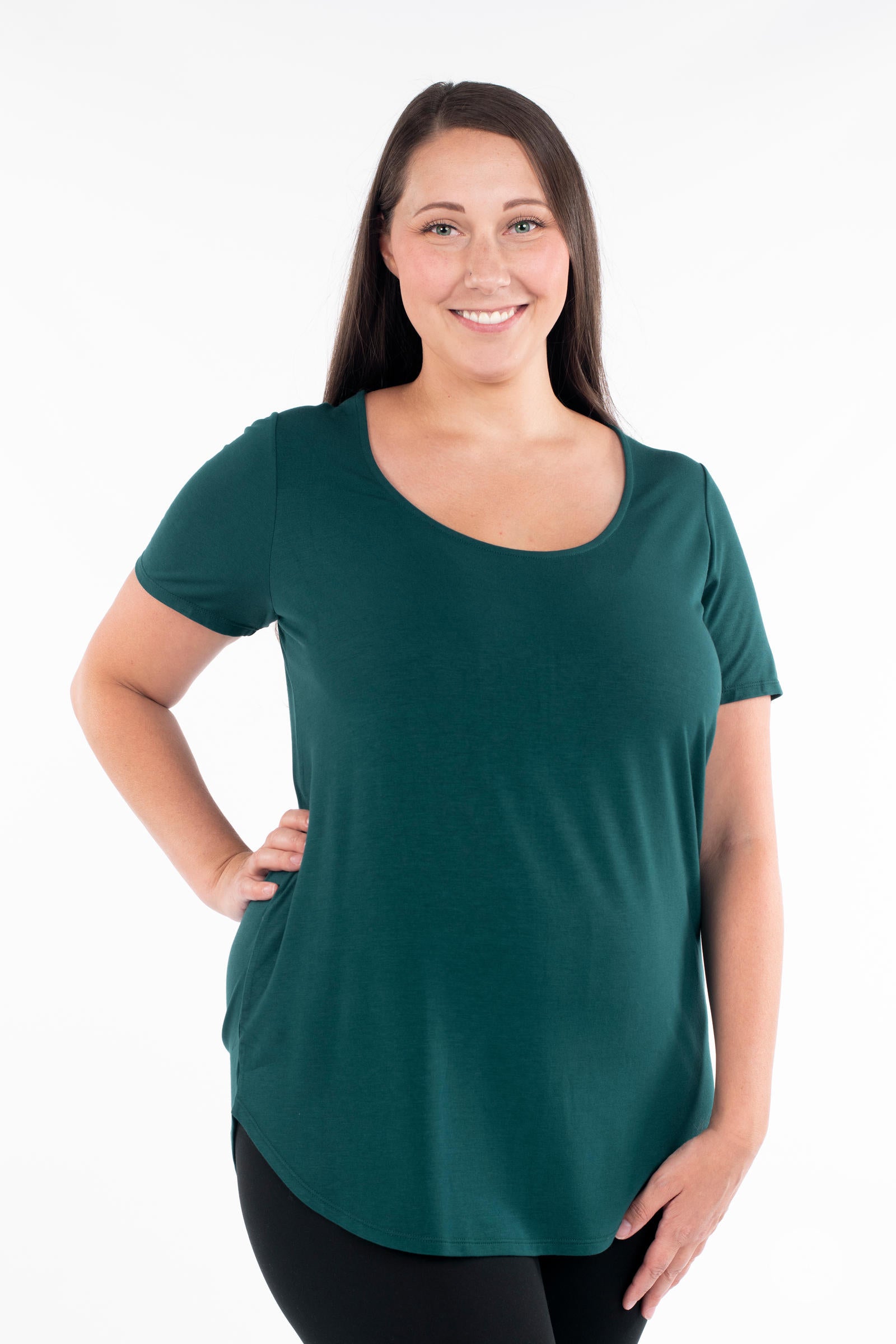 Woman in a dark green Classic Tee by SweetLegs Canada with scoop neckline and relaxed fit front pose