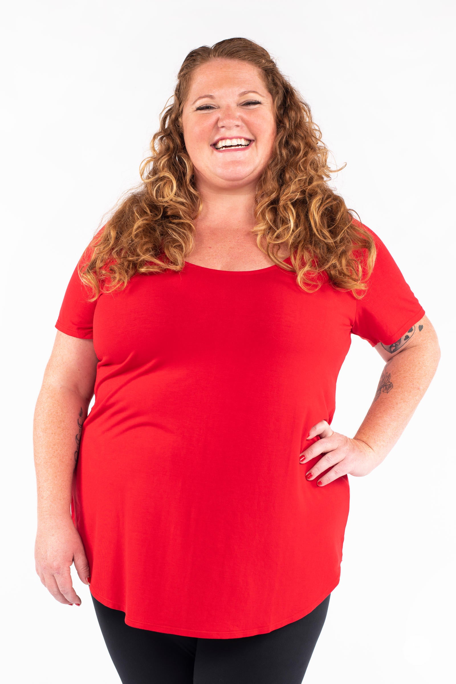 Smiling plus size woman wearing red Classic Tee by SweetLegs Canada with scoop neck and relaxed fit front view