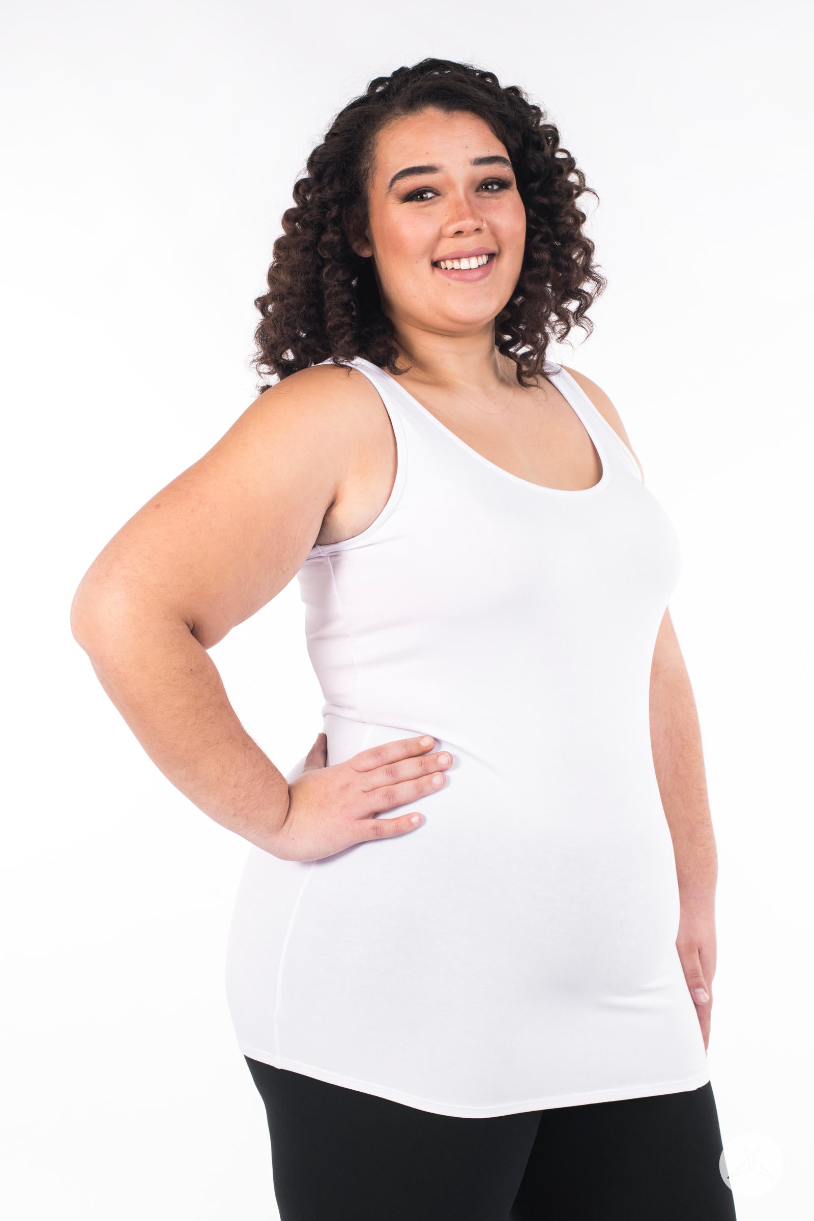 Plus-size model smiling and wearing SweetLegs Canada Classic Layering Tank in white with a smooth, fitted look