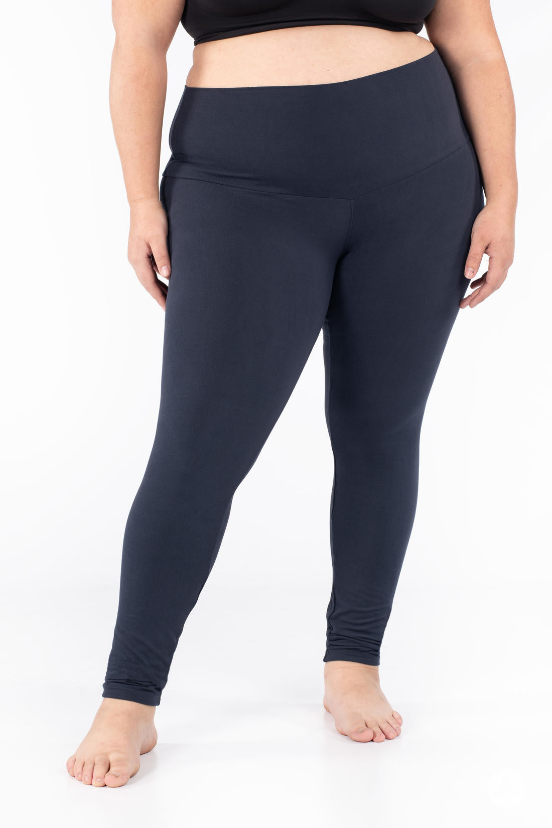 Plus-size model wearing SweetLegs Navy Wide Waistband Leggings with a smooth, mid-rise wide waistband and comfortable fit