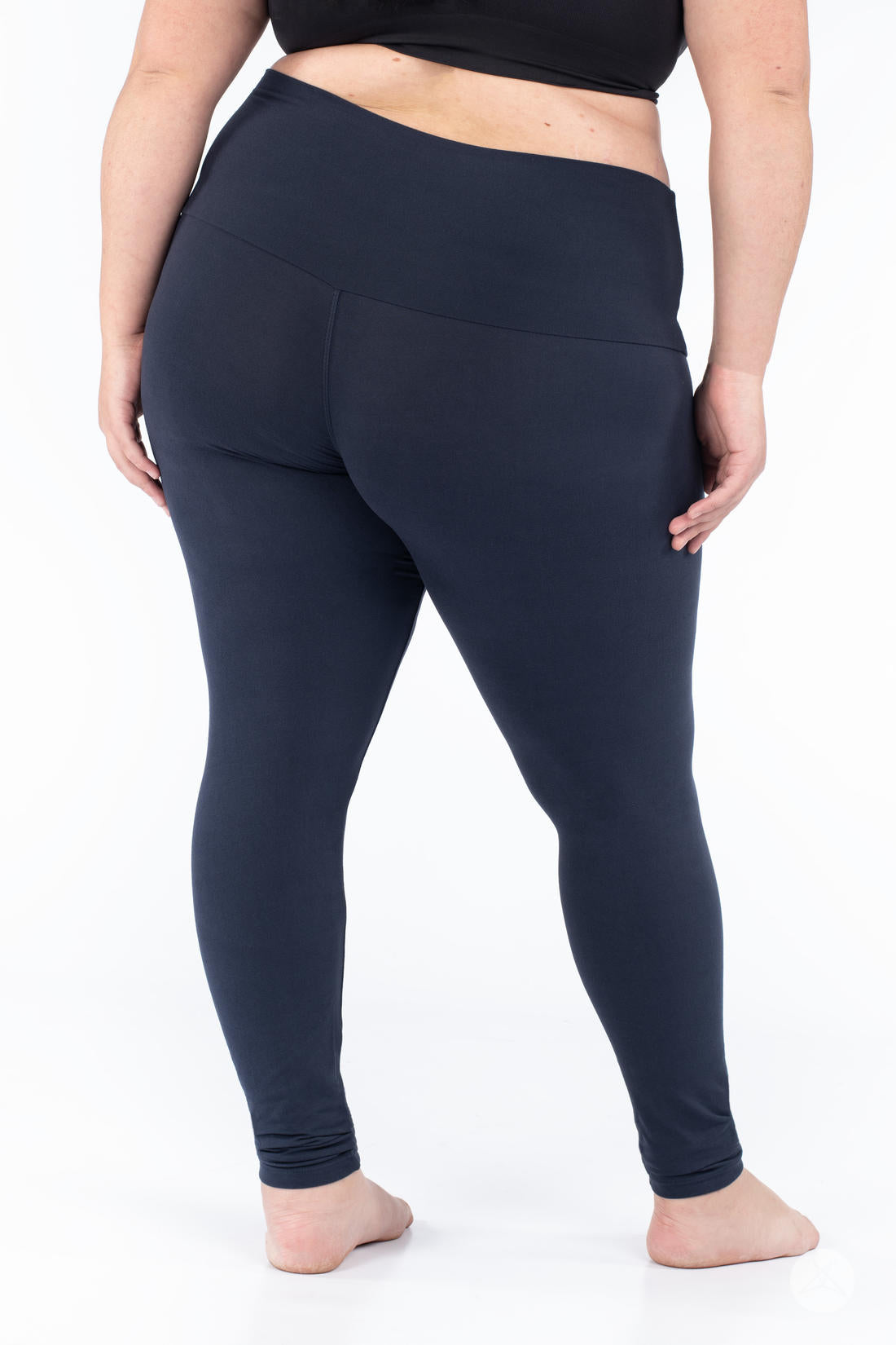 Plus-size model showcasing SweetLegs Navy Wide Waistband Leggings with a smooth fit and supportive mid-rise waistband