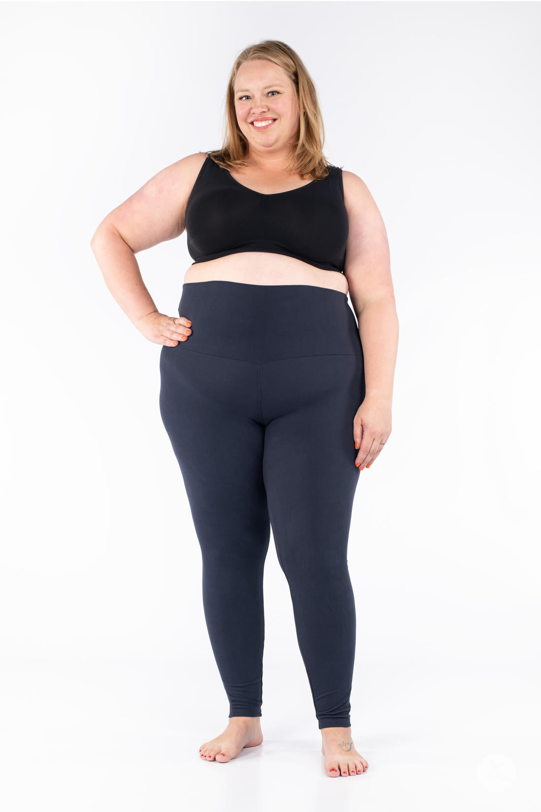Plus-size model wearing SweetLegs Navy Wide Waistband Leggings with a smooth, supportive wide yoga-style mid-rise waistband