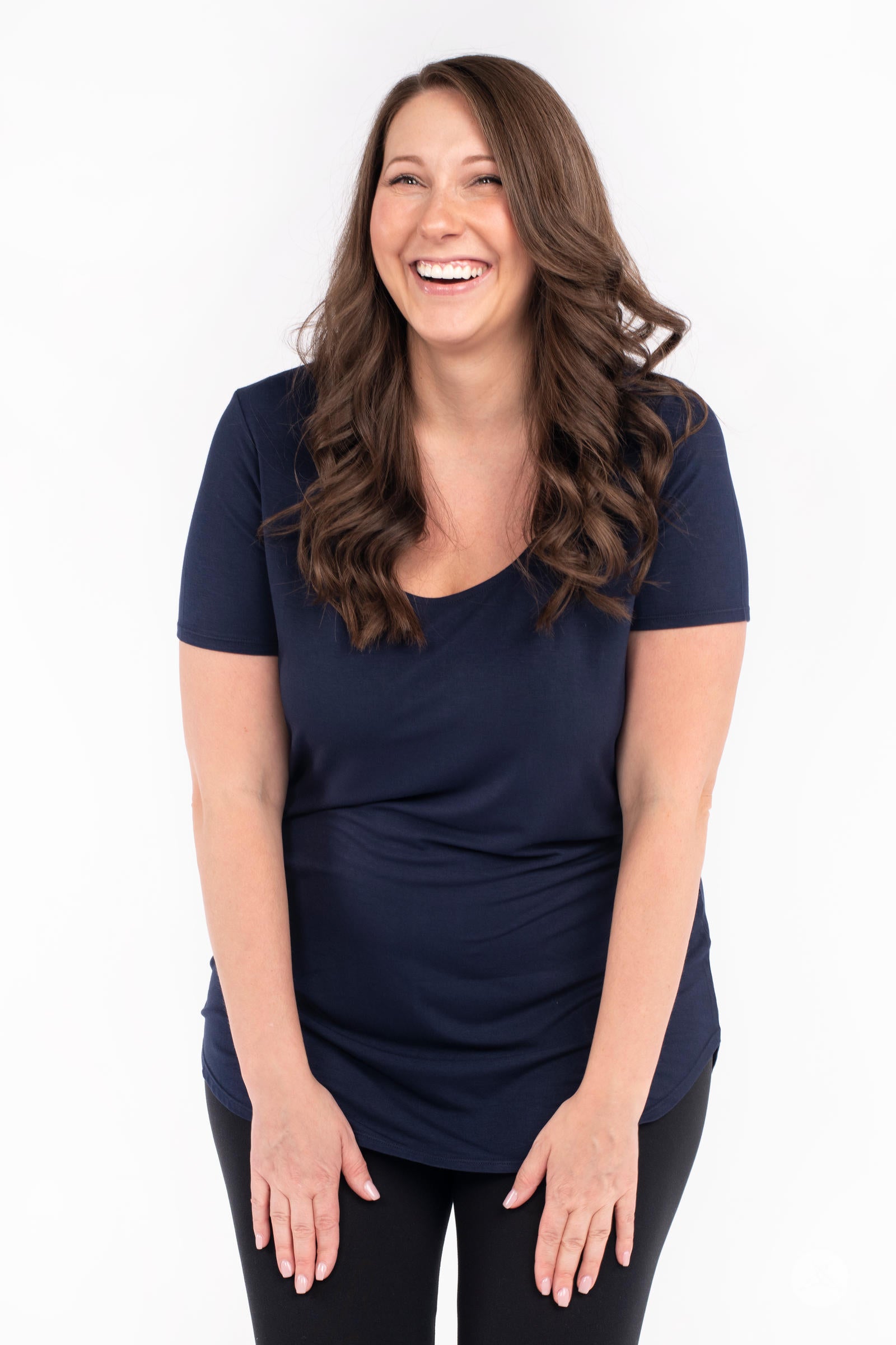 Happy woman wearing navy Classic Tee by SweetLegs Canada with scoop neck and short sleeves front view