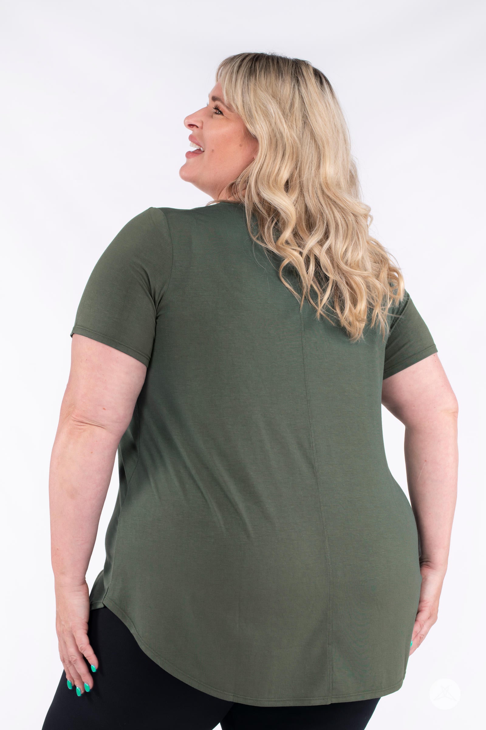 Plus size model showing back of olive Classic Tee by SweetLegs Canada with short sleeves and curved high to low hem