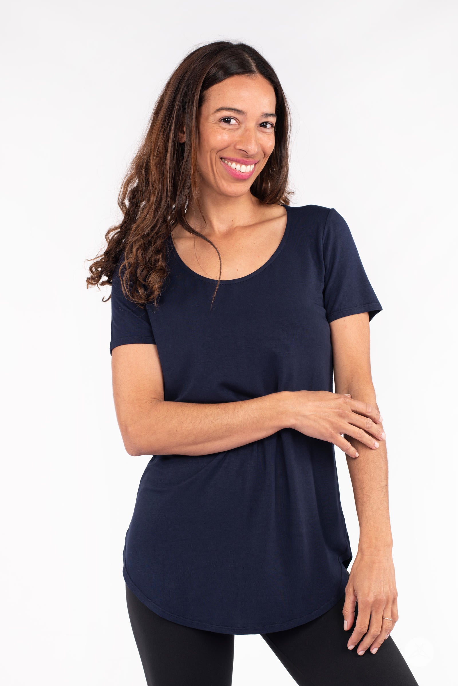 Model smiling wearing navy Classic Tee by SweetLegs Canada with scoop neck and short sleeves front view