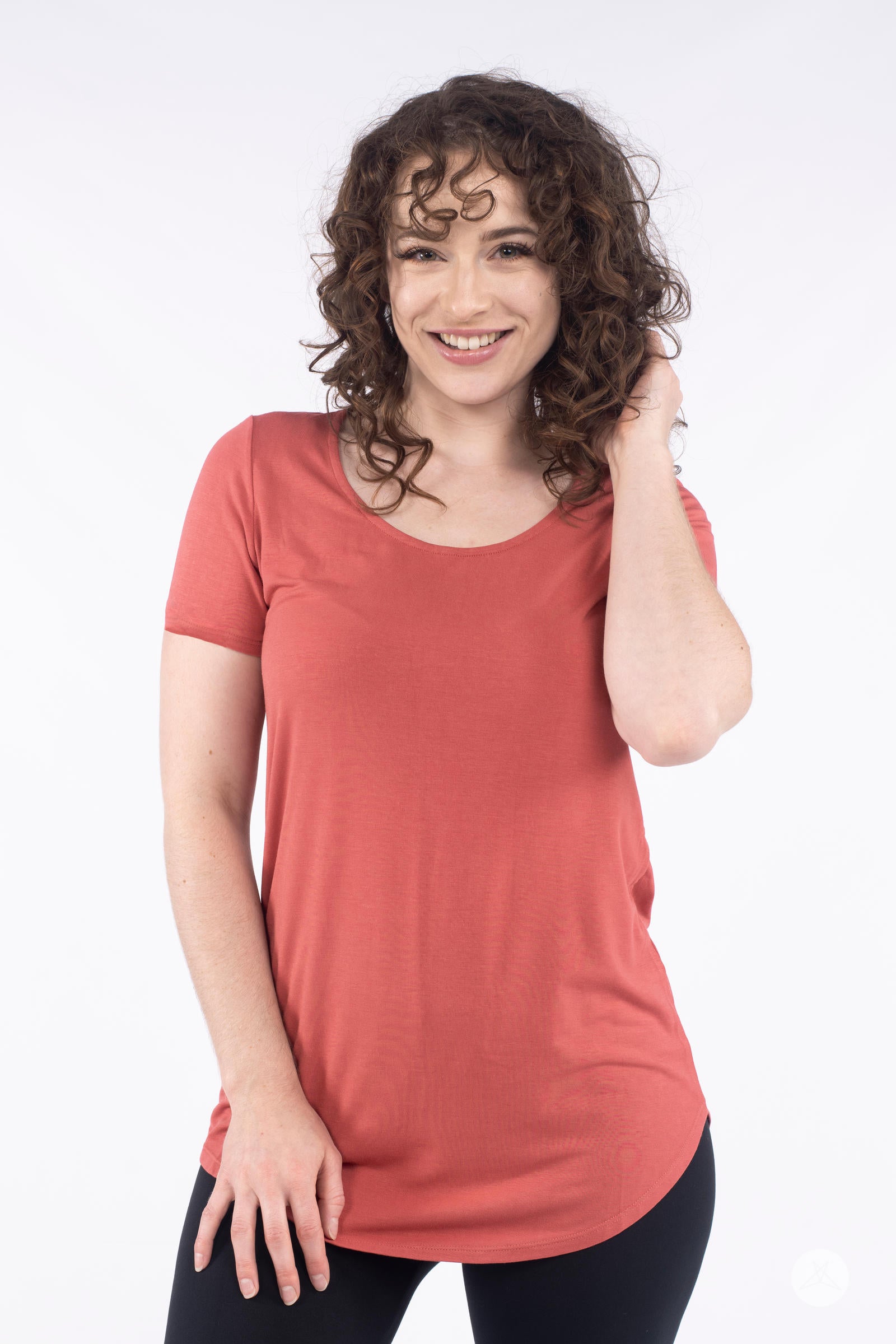 Smiling woman wearing rust Classic Tee by SweetLegs Canada with scoop neck and relaxed fit front view