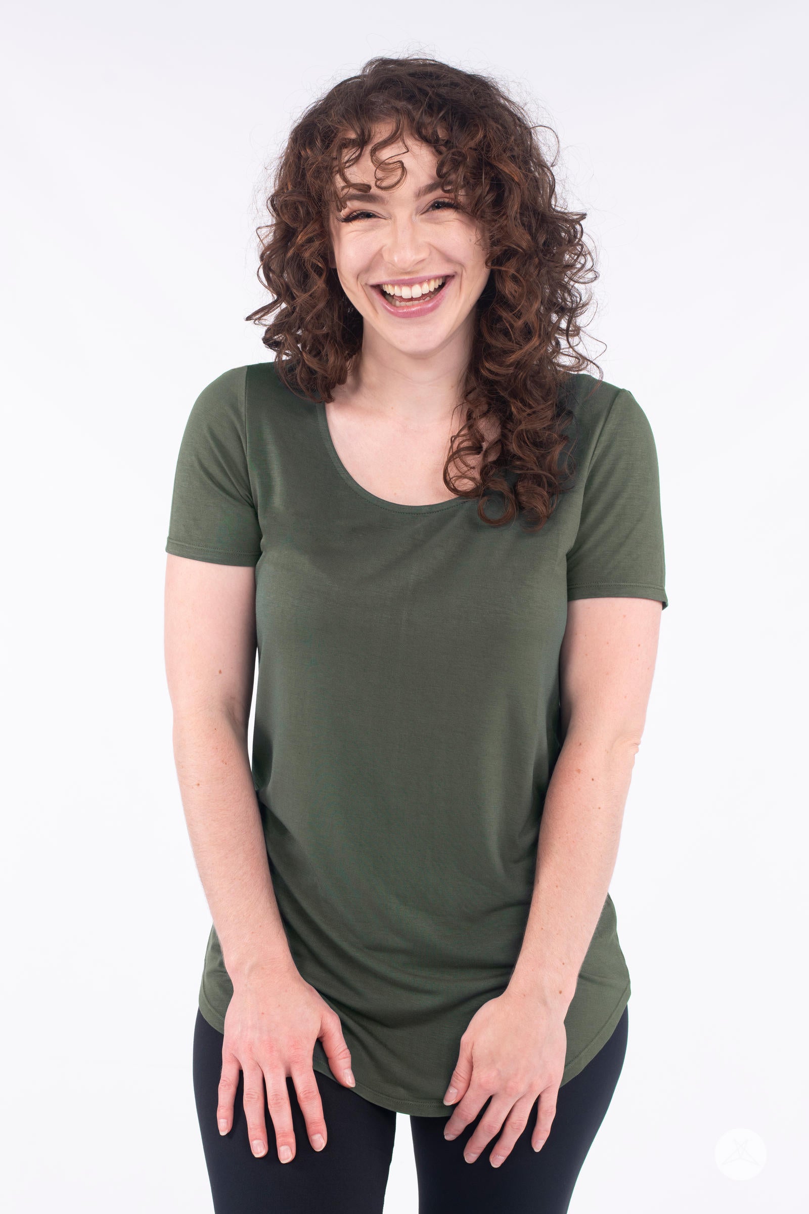 Smiling model wearing olive SweetLegs Canada Classic Tee with scoop neckline and short sleeves facing front