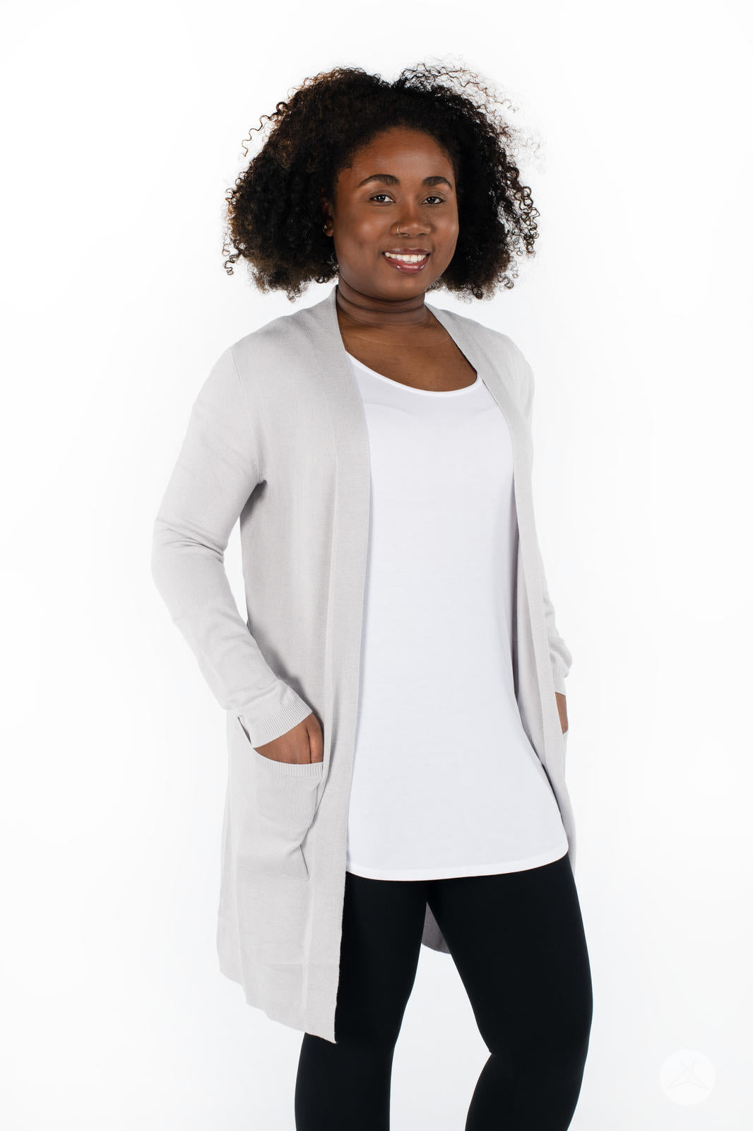 Model wearing SweetLegs Canada Spring Cardigan in light grey with patch pockets over white top and black leggings