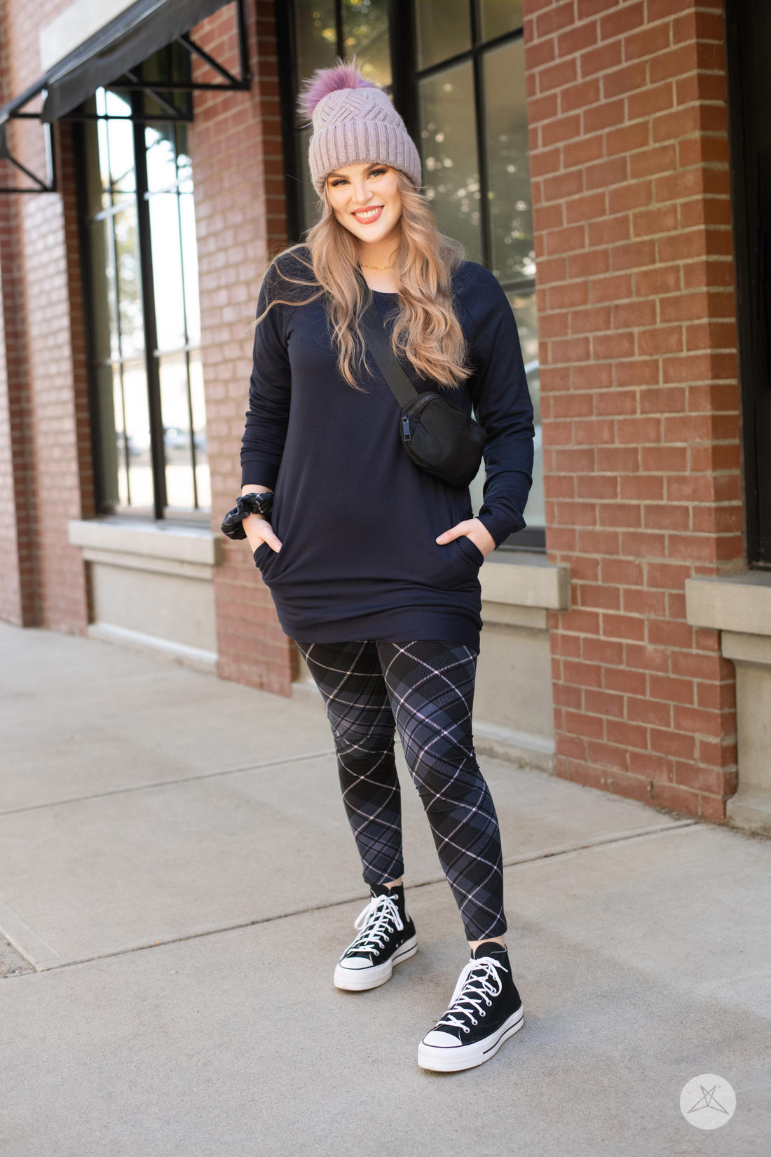 Front view of SweetLegs Take Notice leggings with blue and black diagonal plaid paired with navy tunic and beanie