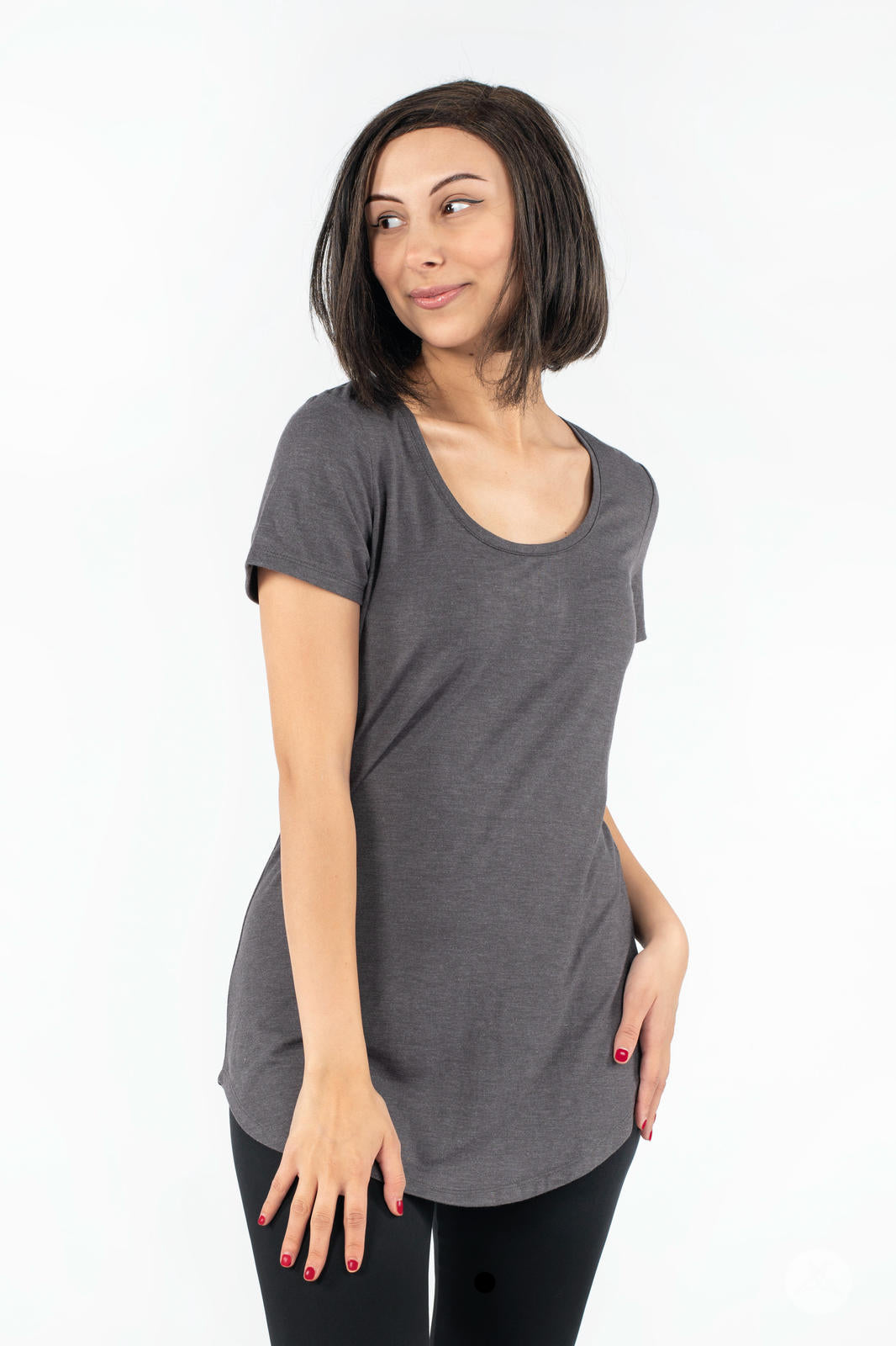 Woman looking sideways wearing SweetLegs Canada Scoop Neck Tee in charcoal with a curved hem front view