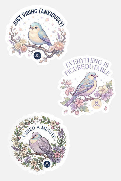 Three pastel-colored bird stickers with flowers and motivational phrases from the I Need A Minute Sticker Pack by SweetLegs