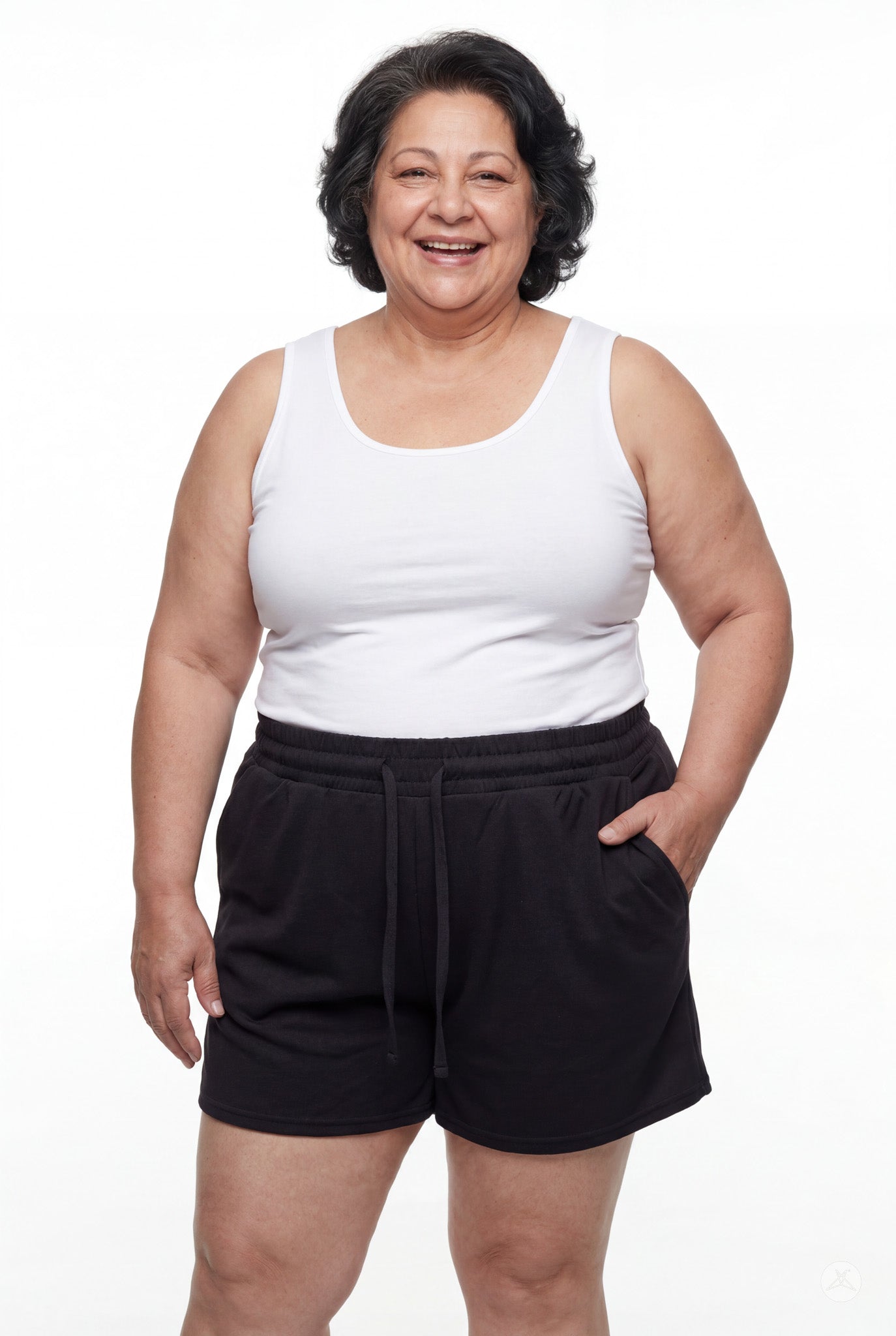 Smiling woman wearing black Lounge Shorts by SweetLegs with elastic waistband and drawstring pockets standing against white background