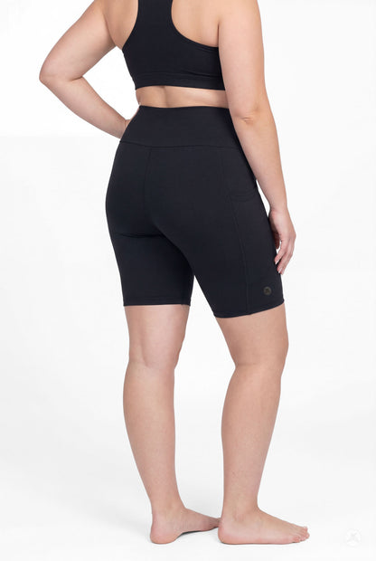 Rear view of model wearing SweetLegs Black High-Waisted Pocket Biker Shorts showing side pocket and fit details