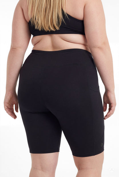 Plus size model showing back view of SweetLegs Black High-Waisted Pocket Biker Shorts with side pocket detail
