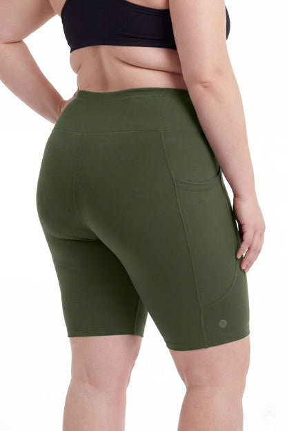 Plus size model showing back view of SweetLegs Cedar High-Waisted Pocket Biker Shorts in olive green with side pocket detail