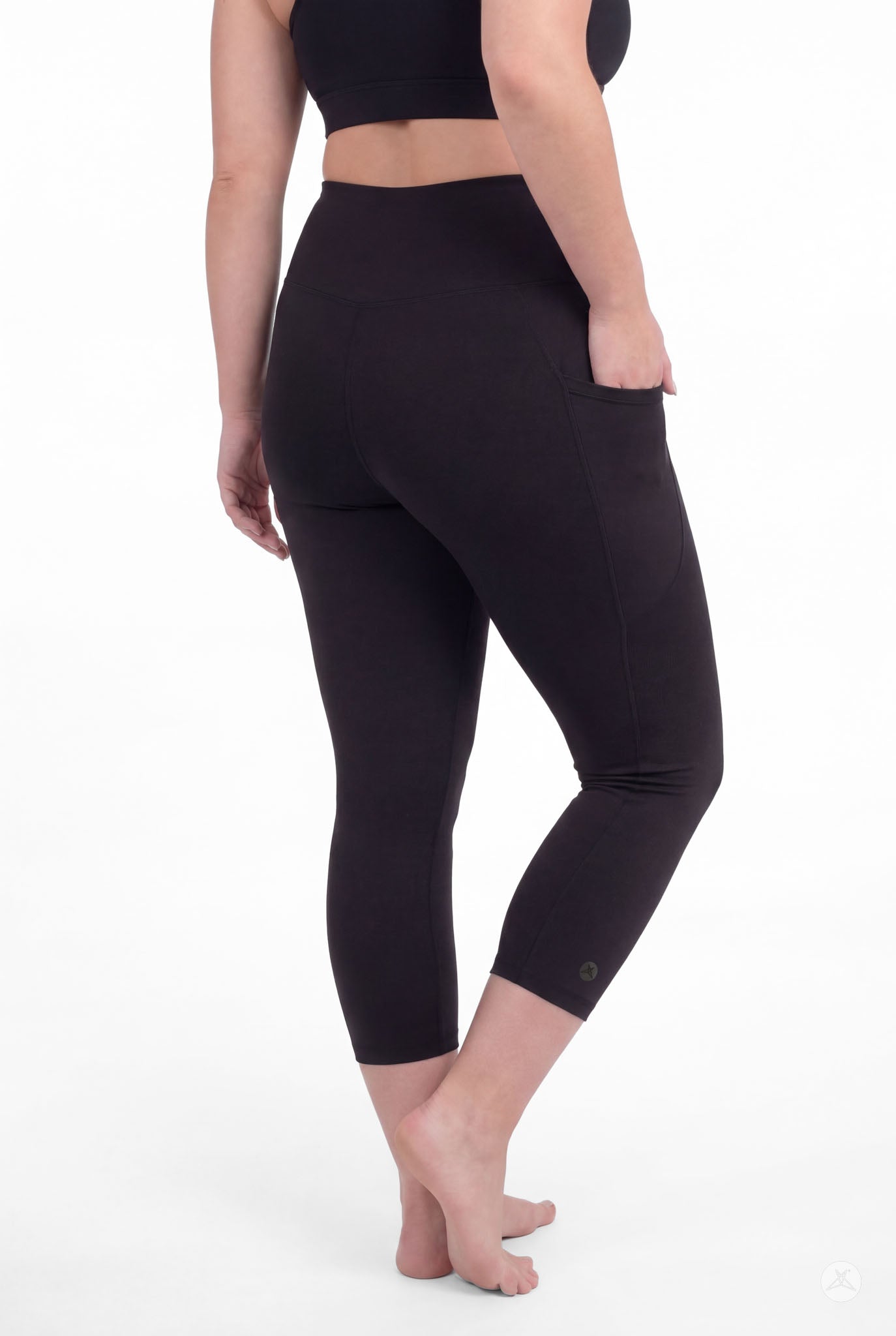Curvy woman barefoot wearing SweetLegs Black High-Waisted Pocket Crops showing side pocket and back view