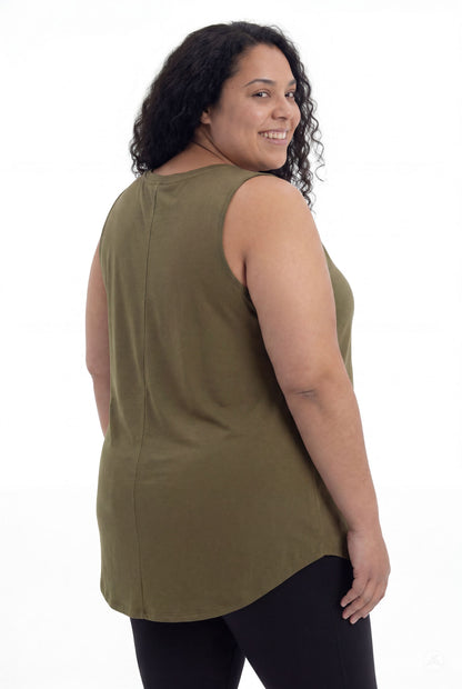 Plus size model smiling over shoulder wearing olive High Neck Swing Tank by SweetTops with black leggings on white background