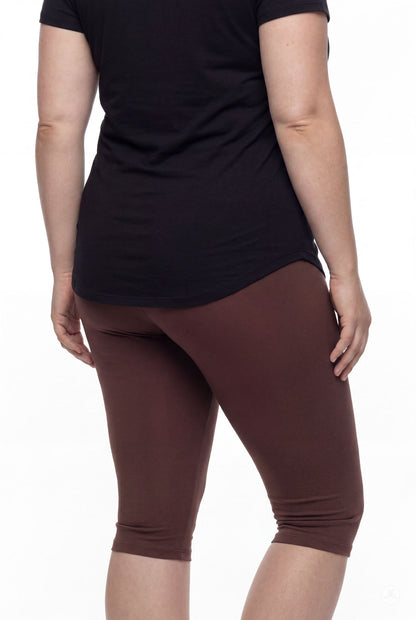 Person wearing SweetLegs Knee-Length Capri in rich walnut brown with black top shown from back on white background