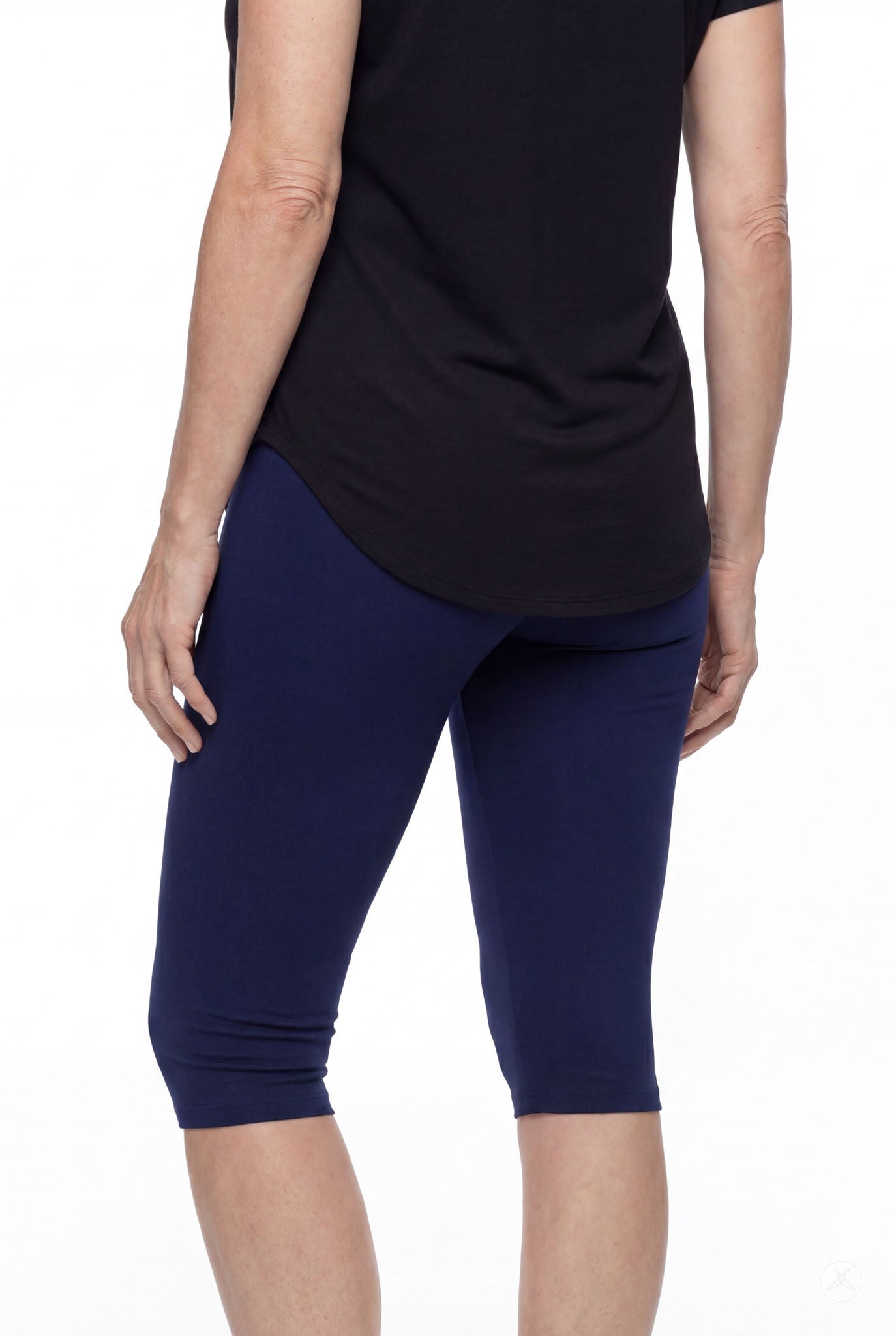 Person shown from back wearing SweetLegs Knee-Length Capri in navy blue paired with black top on white background