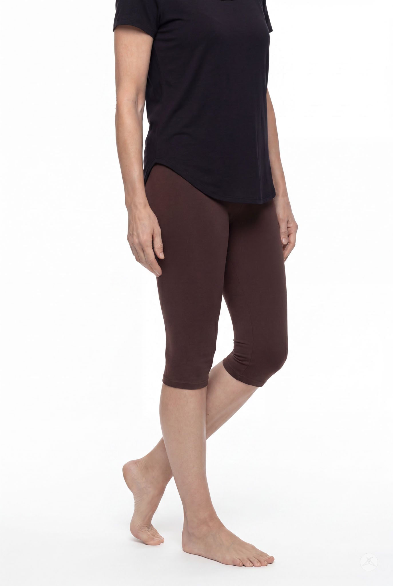 Person wearing SweetLegs Knee-Length Capri in rich brown paired with black top standing barefoot on white background