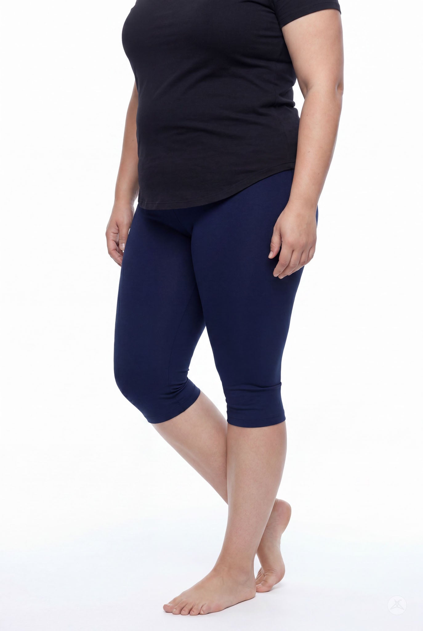 Model wearing SweetLegs Knee-Length Capri in navy blue with black top standing barefoot on white background