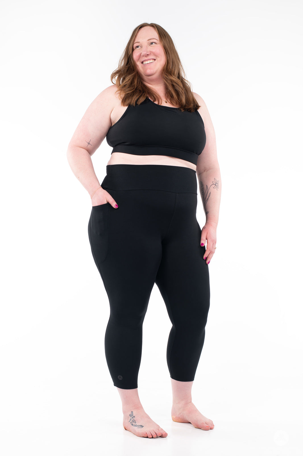 SweetLegs High-Waist Pocket Crops in black worn by a smiling woman with side pockets