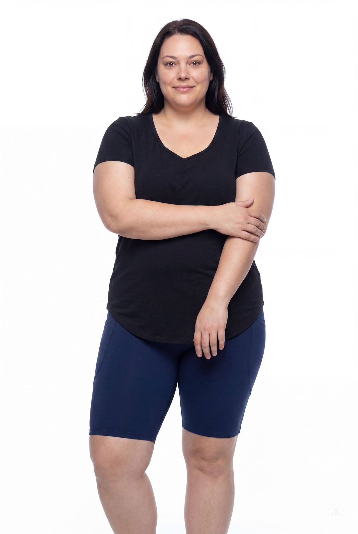Plus size woman wearing SweetLegs Still Water Pocket Biker Shorts in navy with elastic waistband and comfortable fit