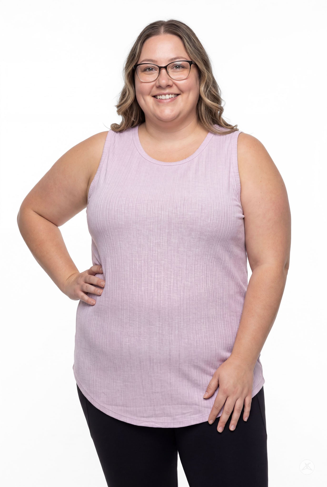 Plus size model smiling wearing SweetTops The Soft Ribbed Tank in soft lilac with black leggings, front view