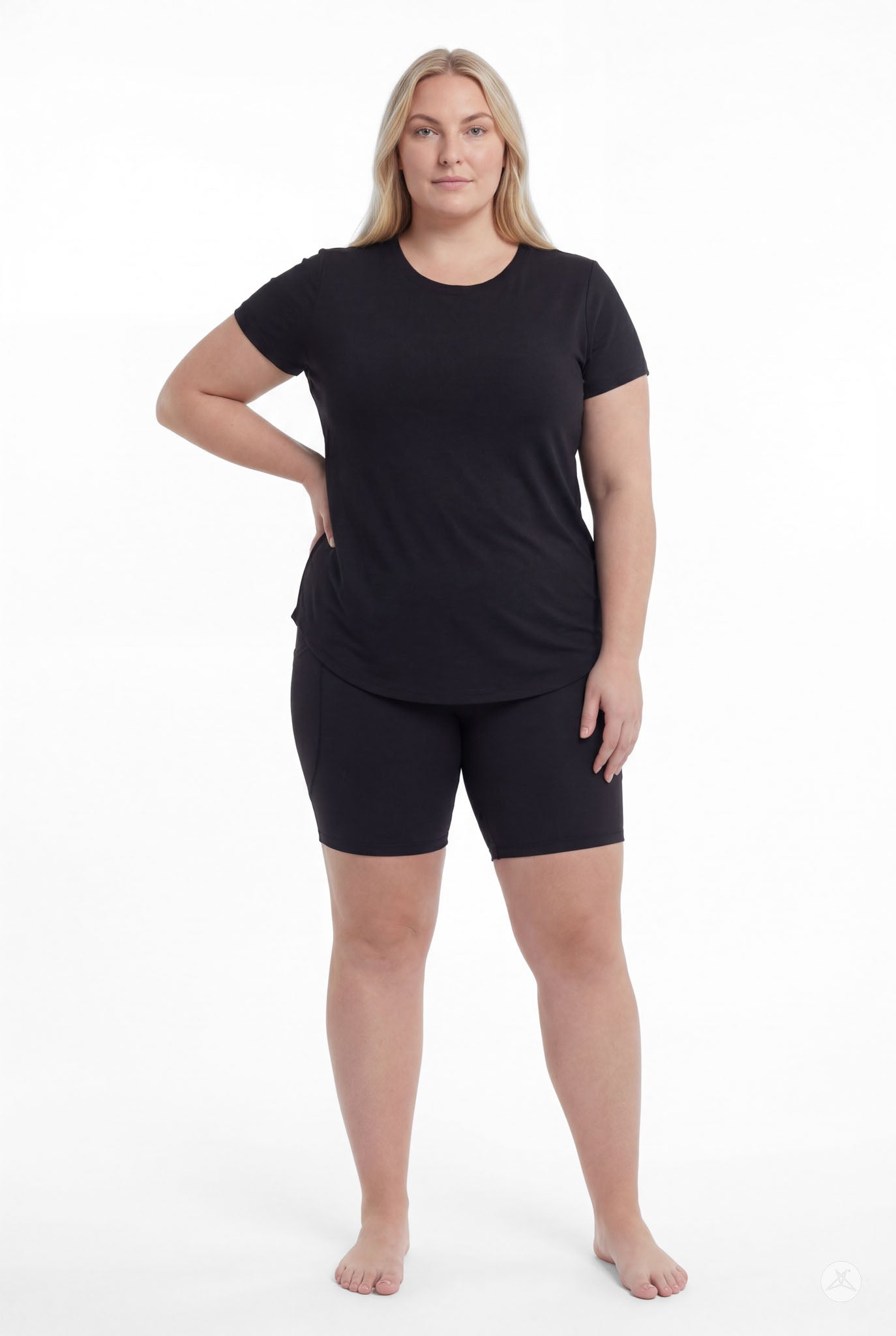 Plus size woman standing barefoot wearing SweetLegs Black Pocket Biker Shorts with black t-shirt front view
