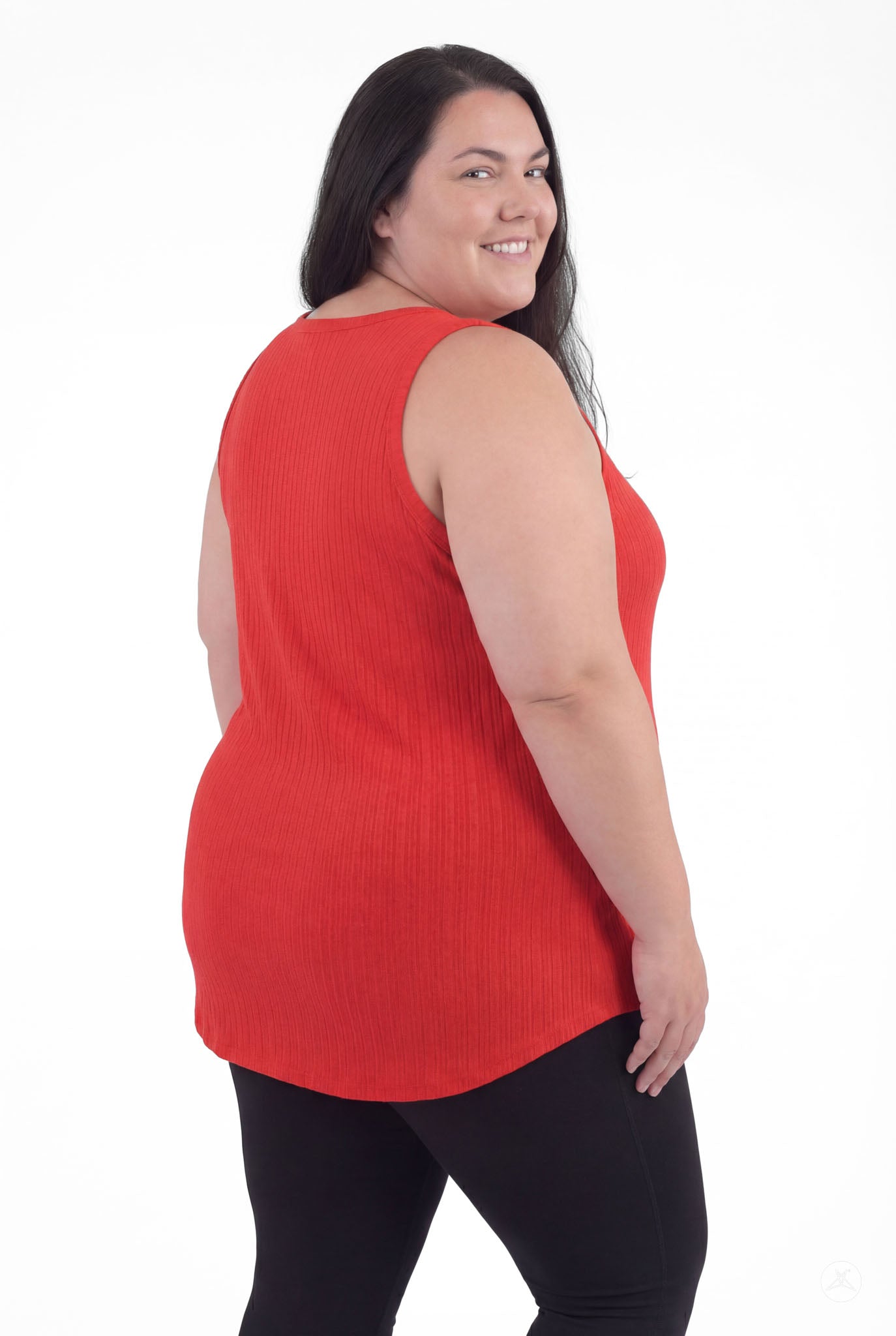 Plus size woman smiling wearing The Soft Ribbed Tank in rich rouge by SweetTops showing back view with ribbed texture