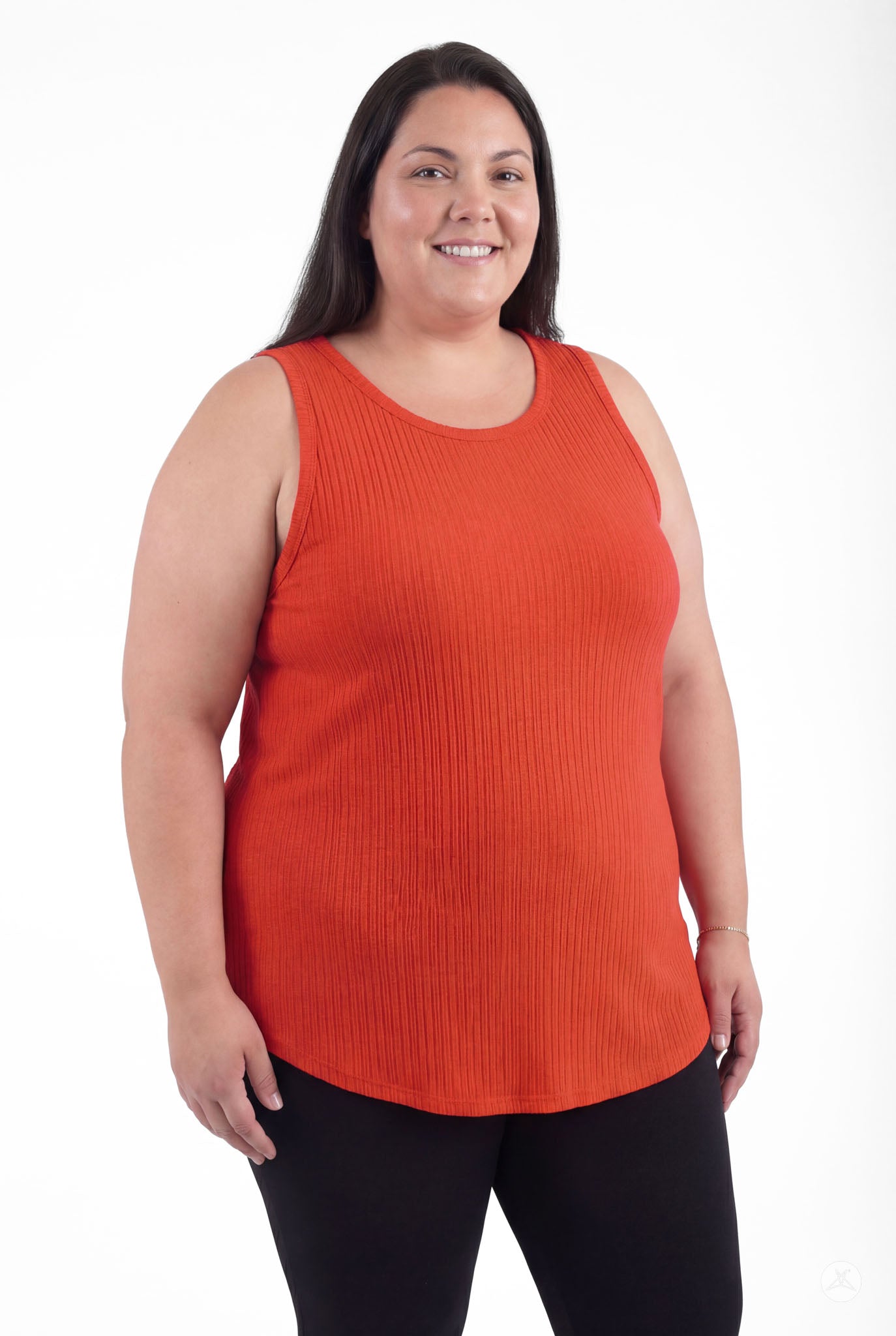 Plus size woman smiling wearing The Soft Ribbed Tank in deep orange by SweetTops with ribbed fabric and sleeveless cut