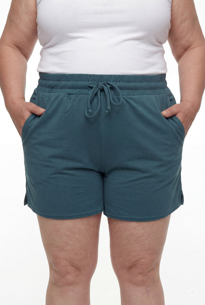 Front view of person wearing teal Lounge Shorts by SweetLegs with elastic waistband, drawstring, and hands in pockets
