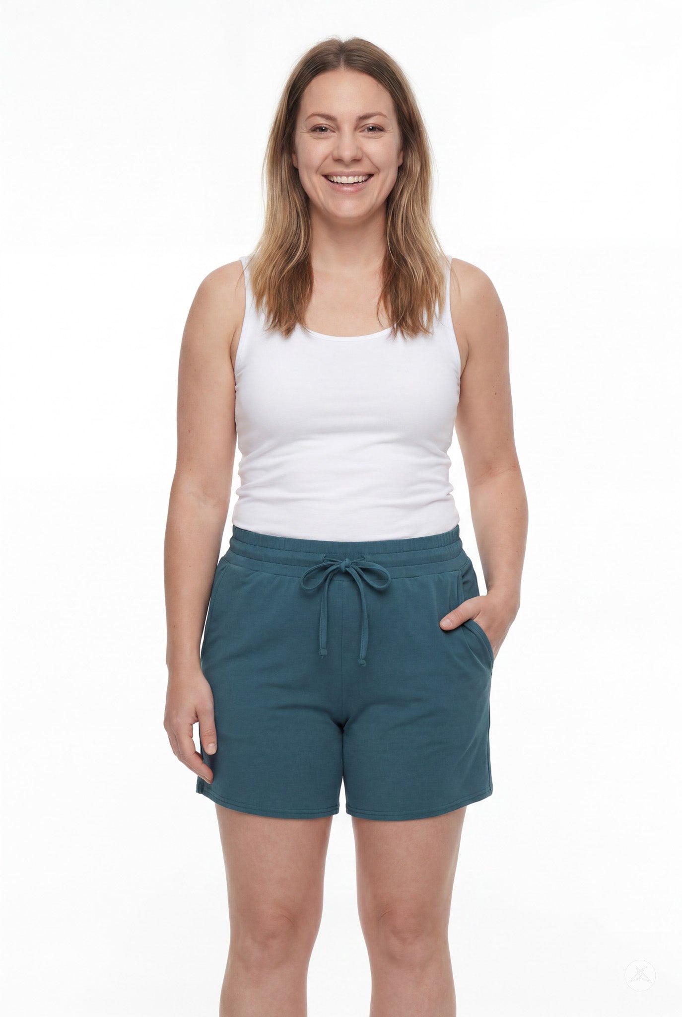 Smiling woman wearing teal Lounge Shorts by SweetLegs with elastic waistband and drawstring pockets on white background